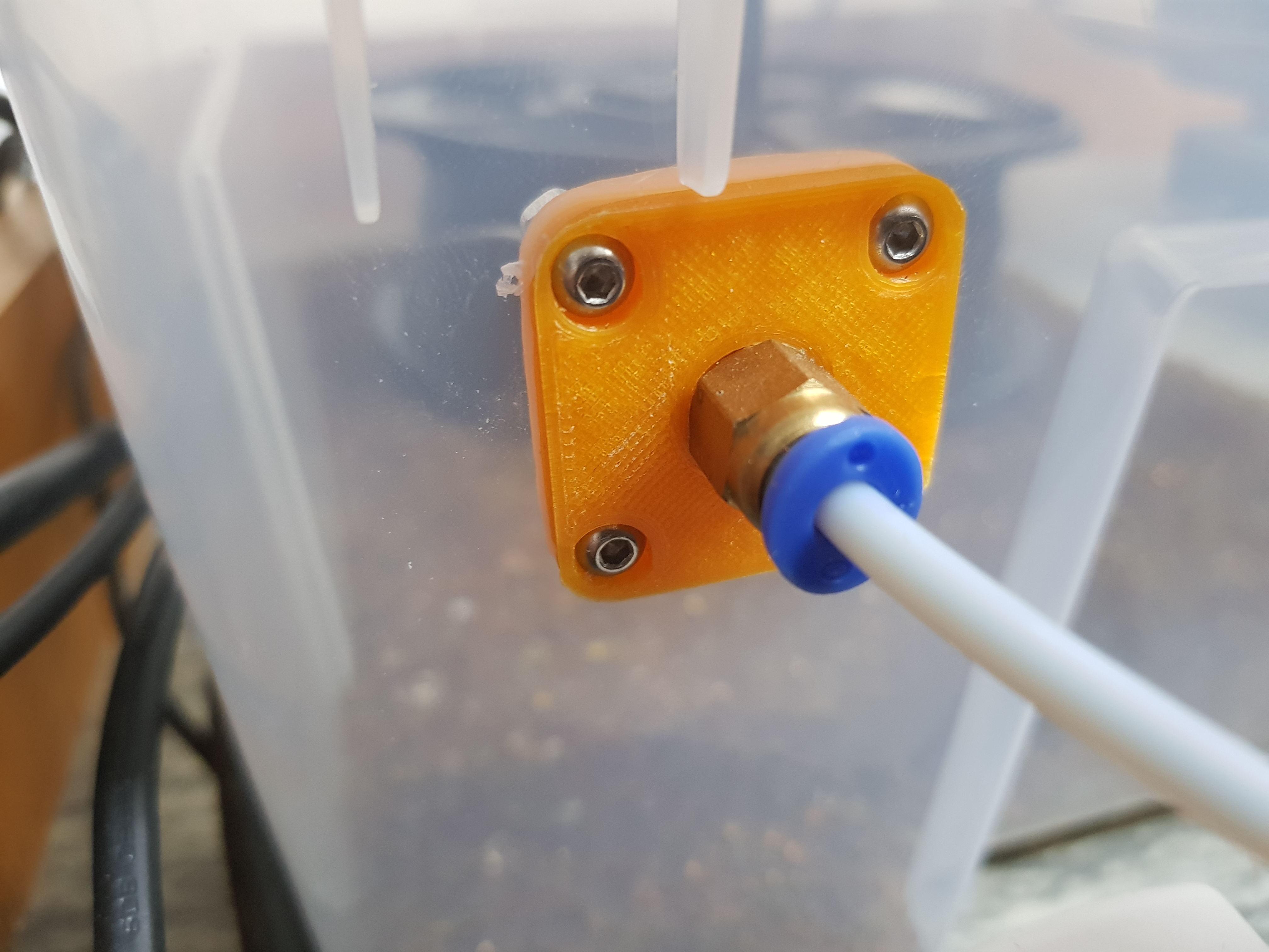 Filament port for plastic storage box