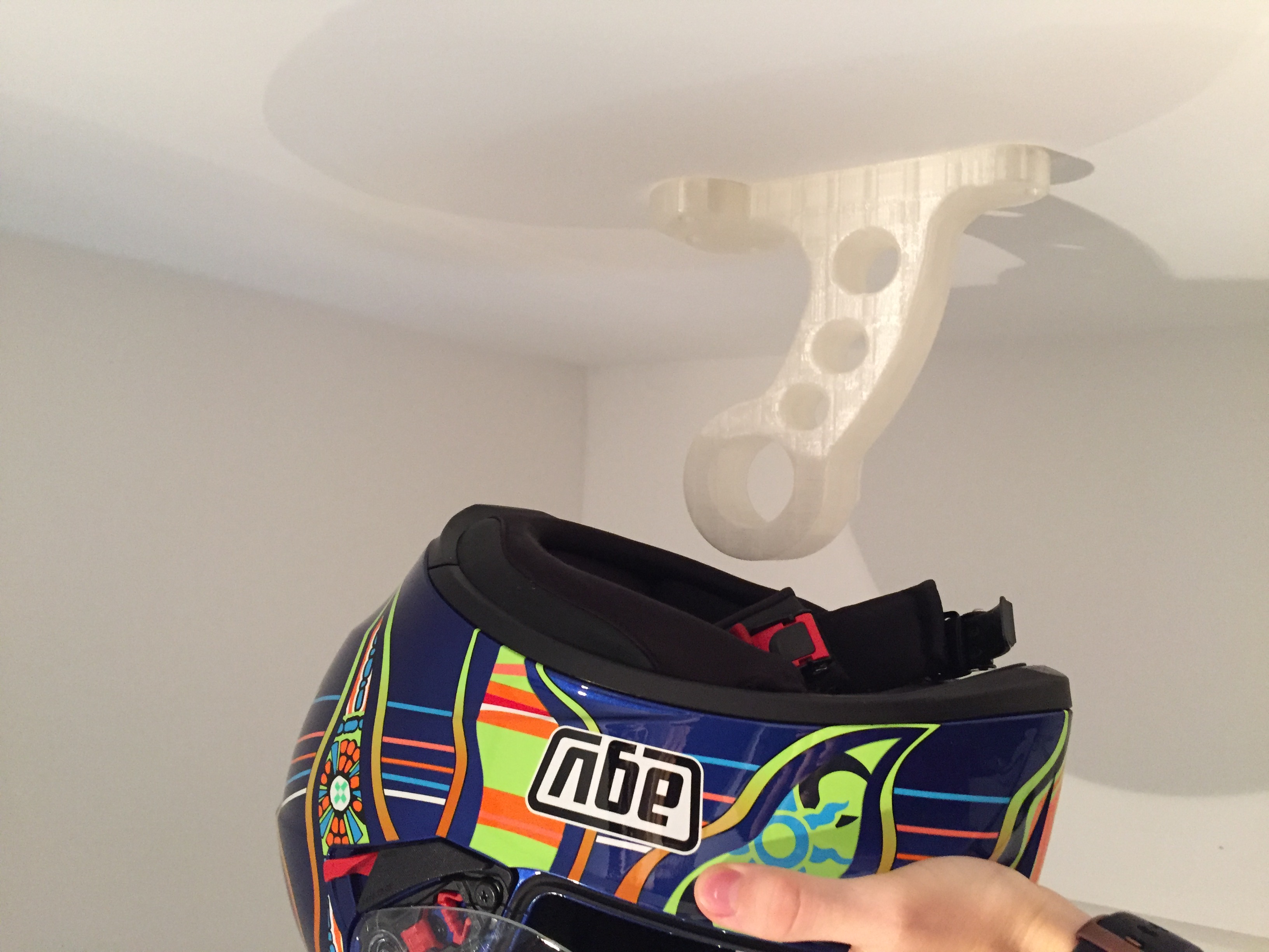 Motorcycle helmet holder