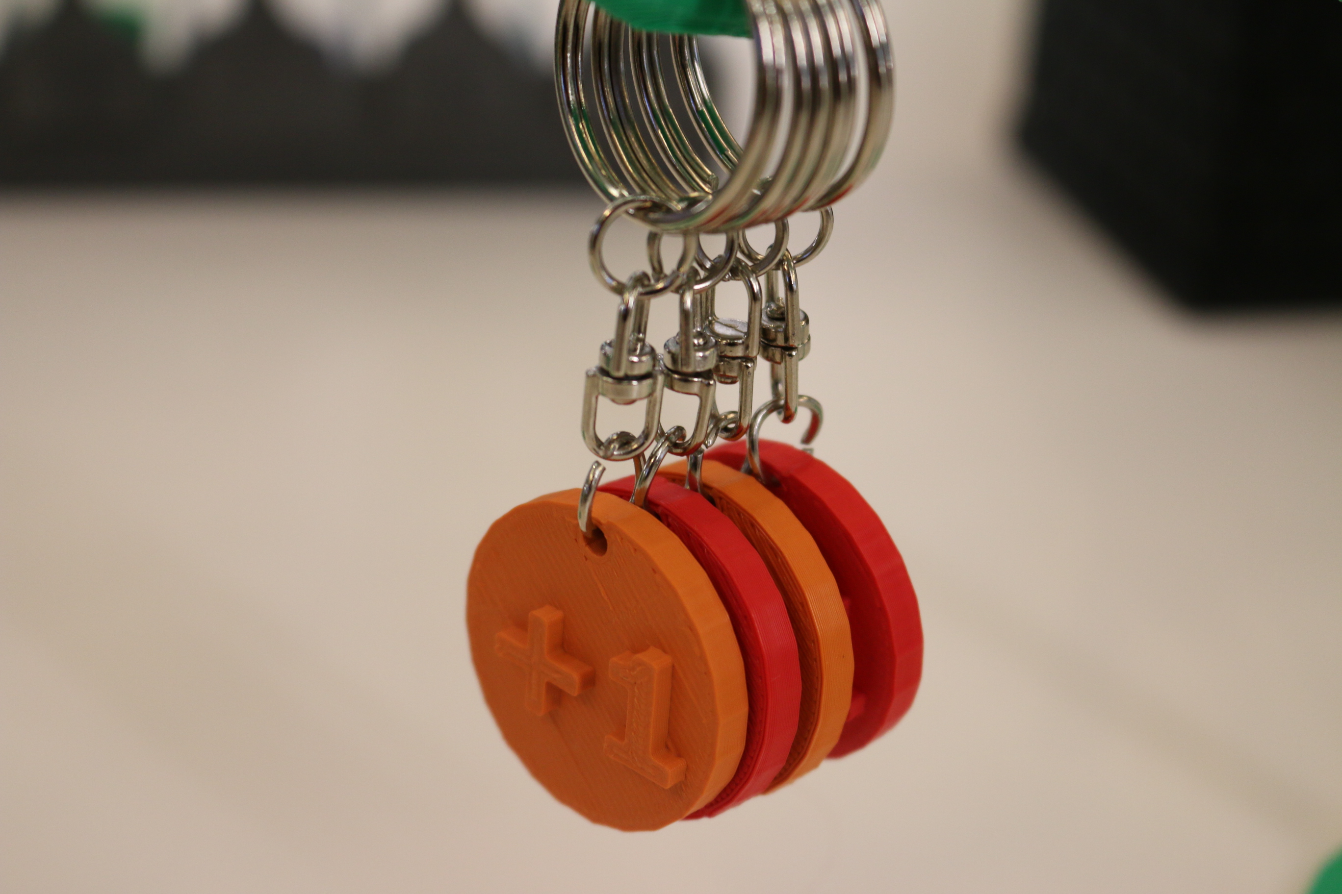 +1 keychain made by Cardif Lab