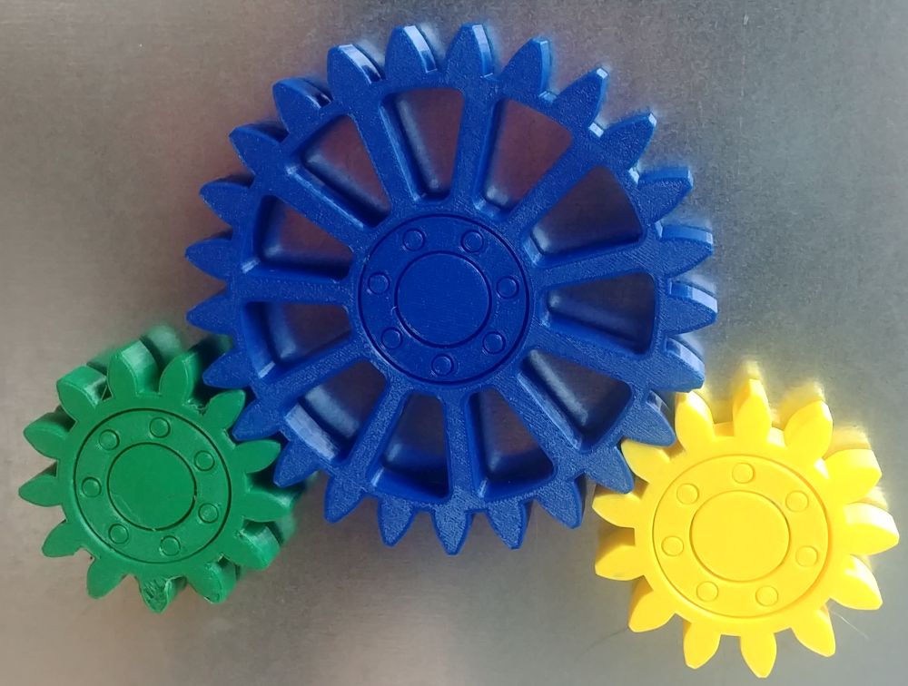 Gears with embedded magnets and integral bearing