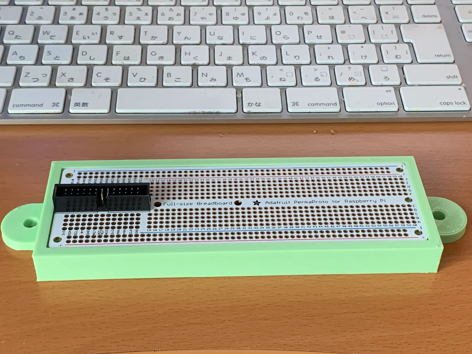 Mount for a full size Perma Proto Board on an 8020 Series 10 extrusion
