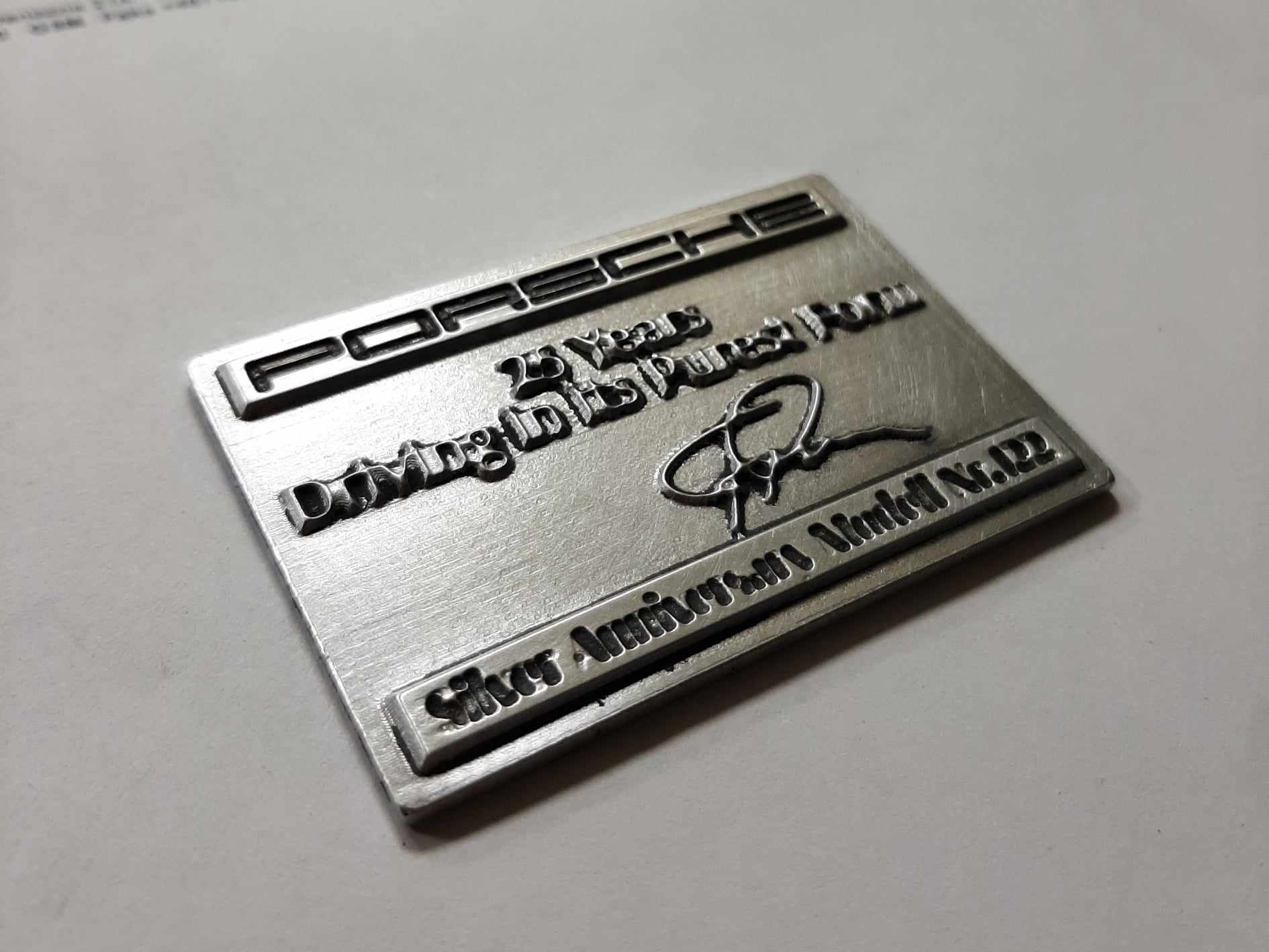 Porshe 25 years anniversary emblem