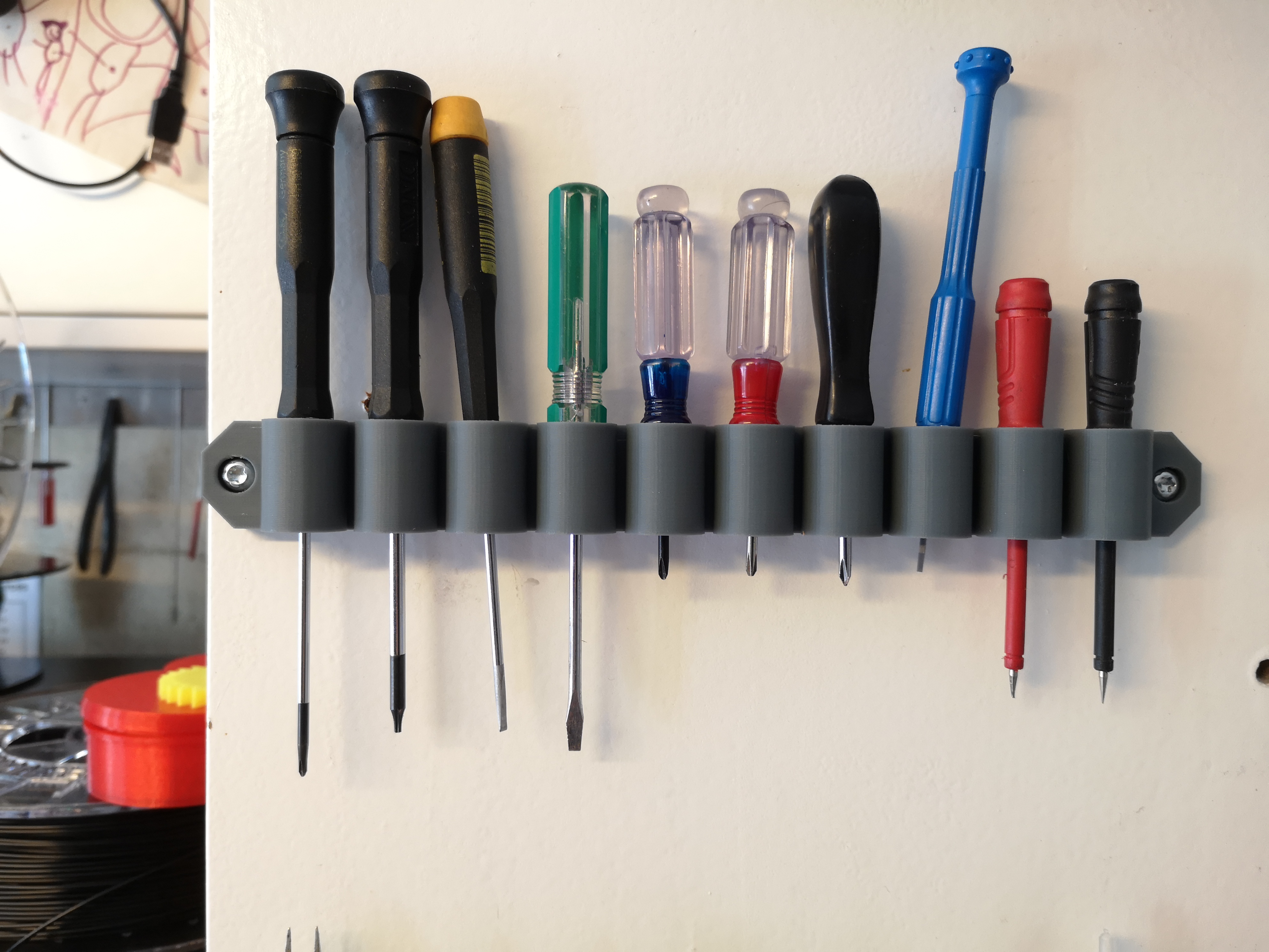 Wall mounted holder for 10 precision screw drivers