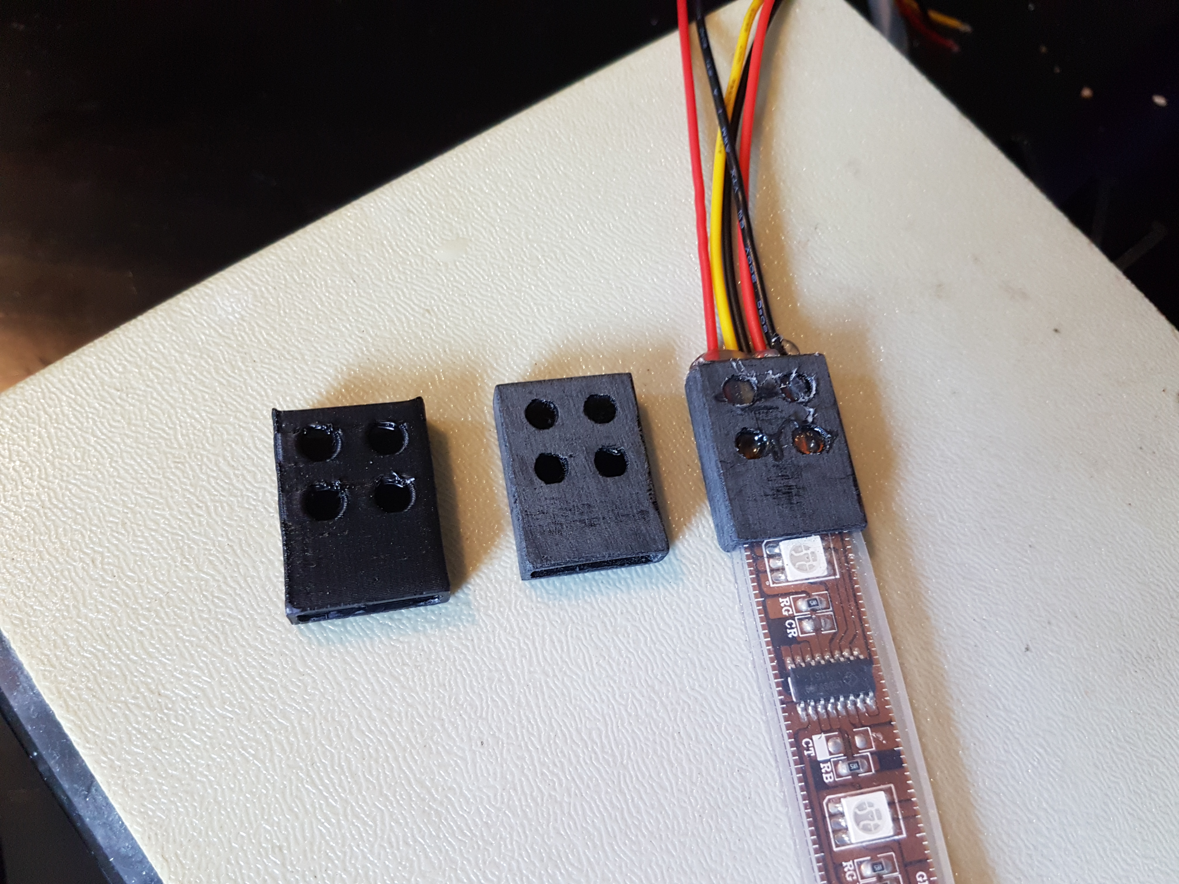 Strain relief for Neopixel strip with silicone cover