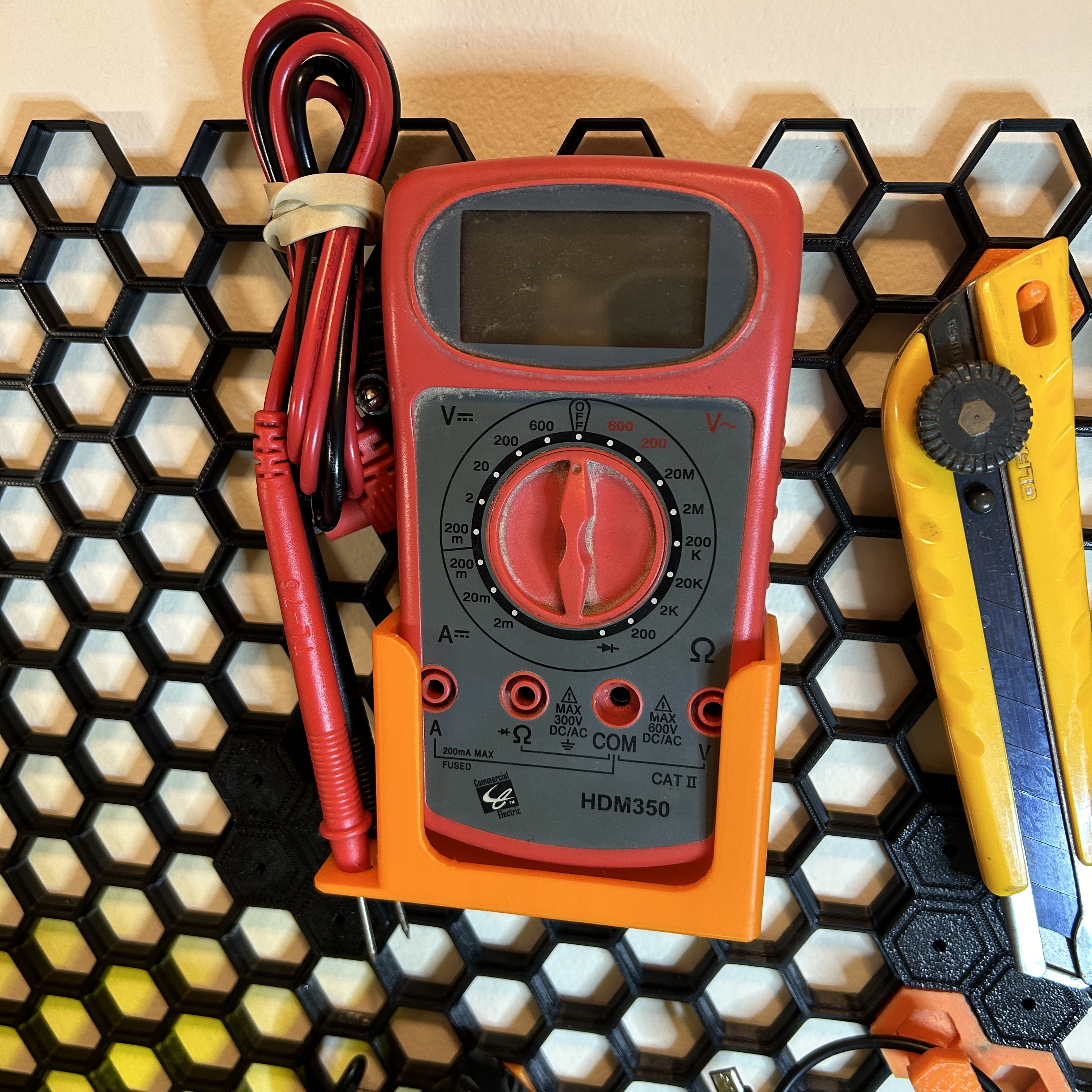 Multimeter Holder for Honeycomb Wall