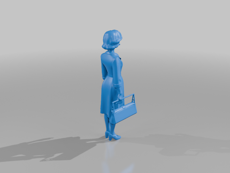 1930s woman standing carring a bag no2