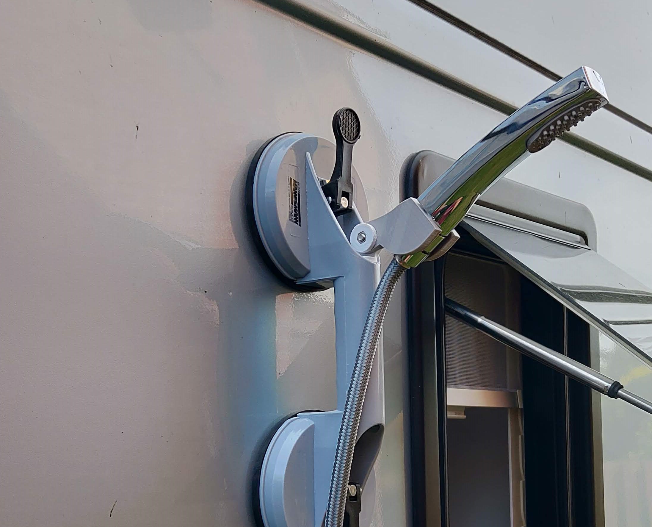 External shower head holder for camper van