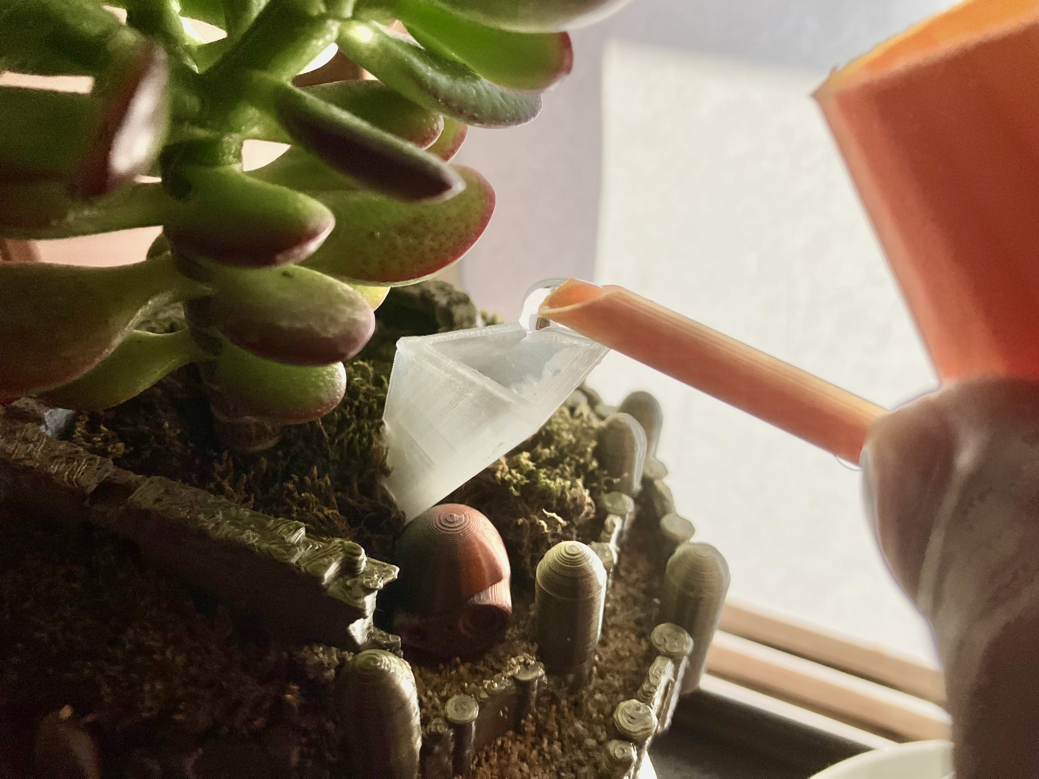 Triangular funnel for watering indoor houseplants