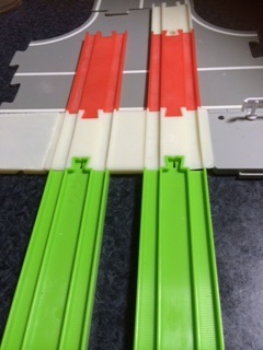 Plarail tram rail on sidewalk