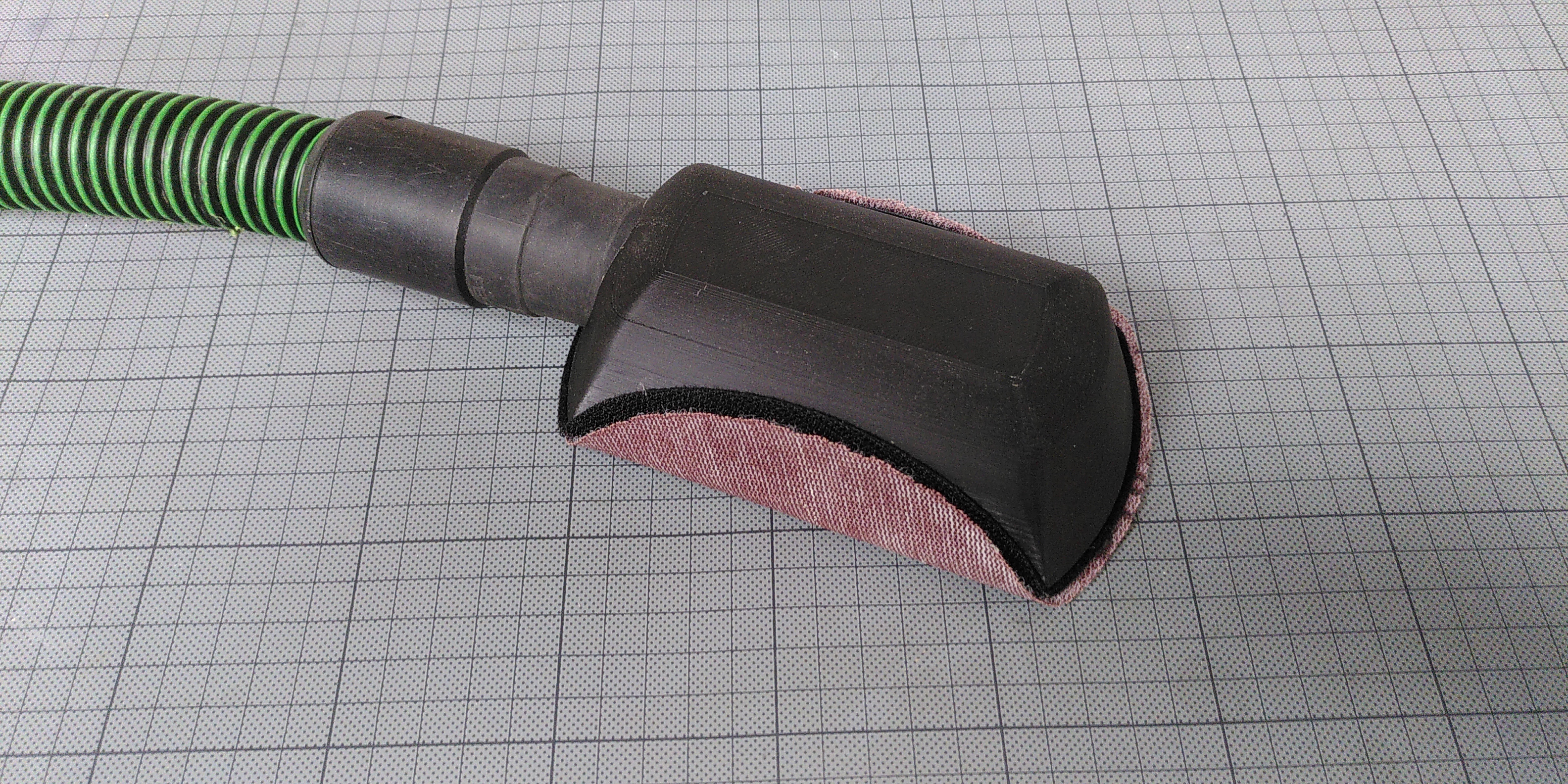 Vacuum-assisted hand sanding block (Mirka sanding grid)
