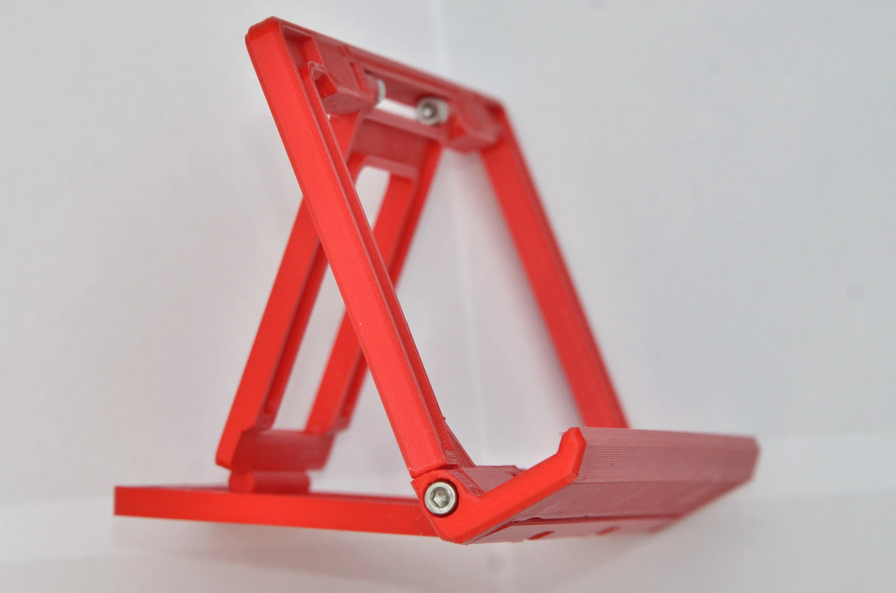 Foldable tilting tablet/phone stand