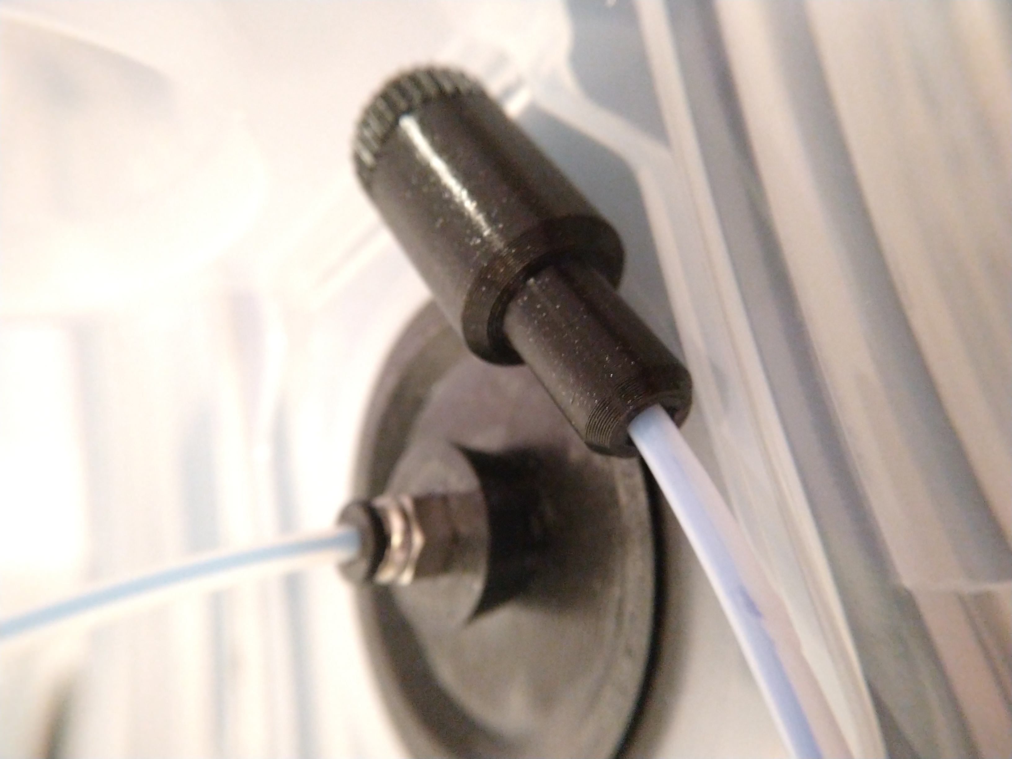 Filament feed tube end cap