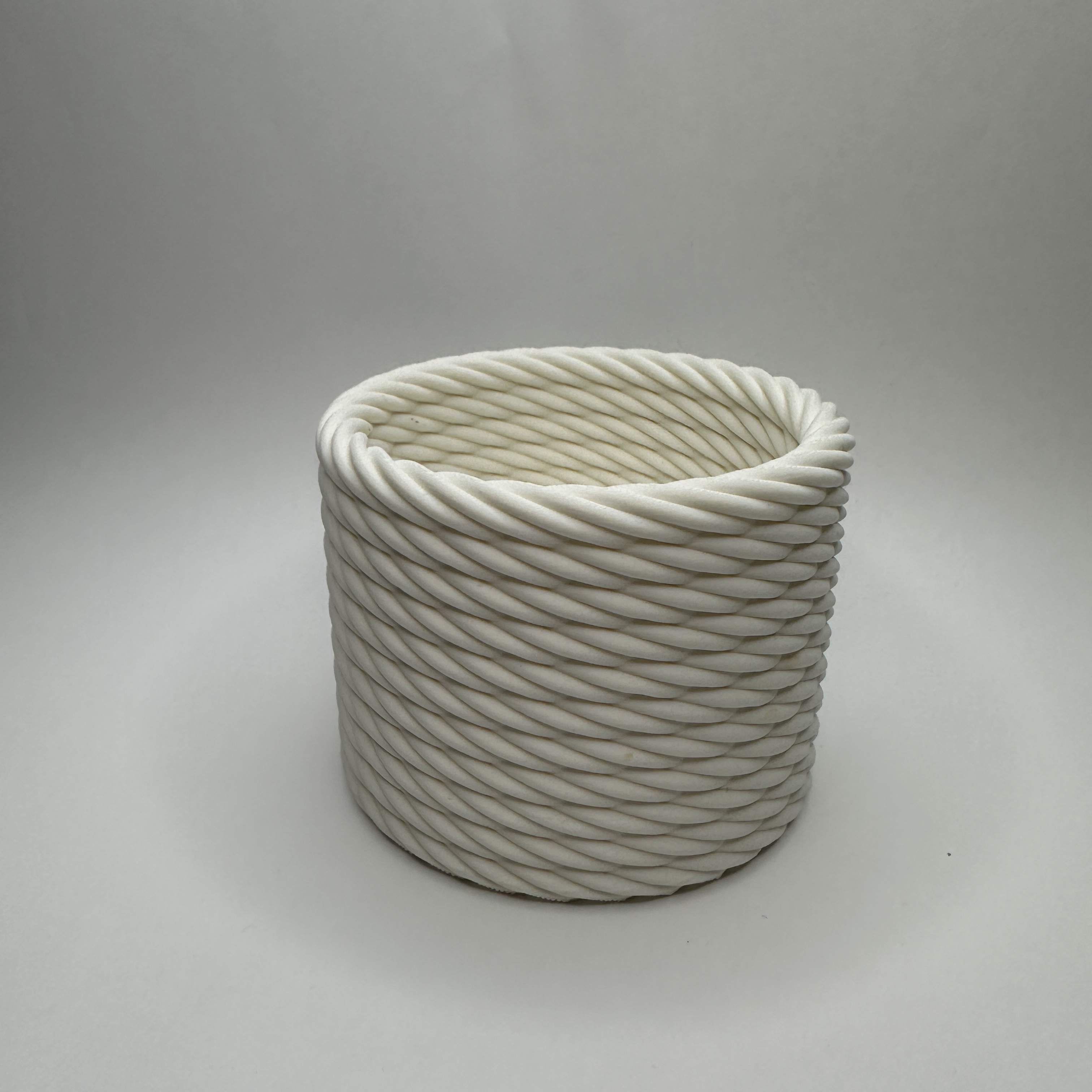 Braided basket look plant pot