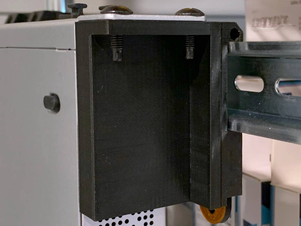 A one rack unit to Din Rail bracket