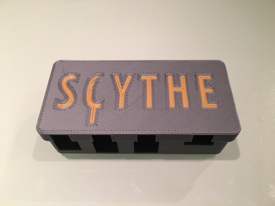 Scythe Coin Holder