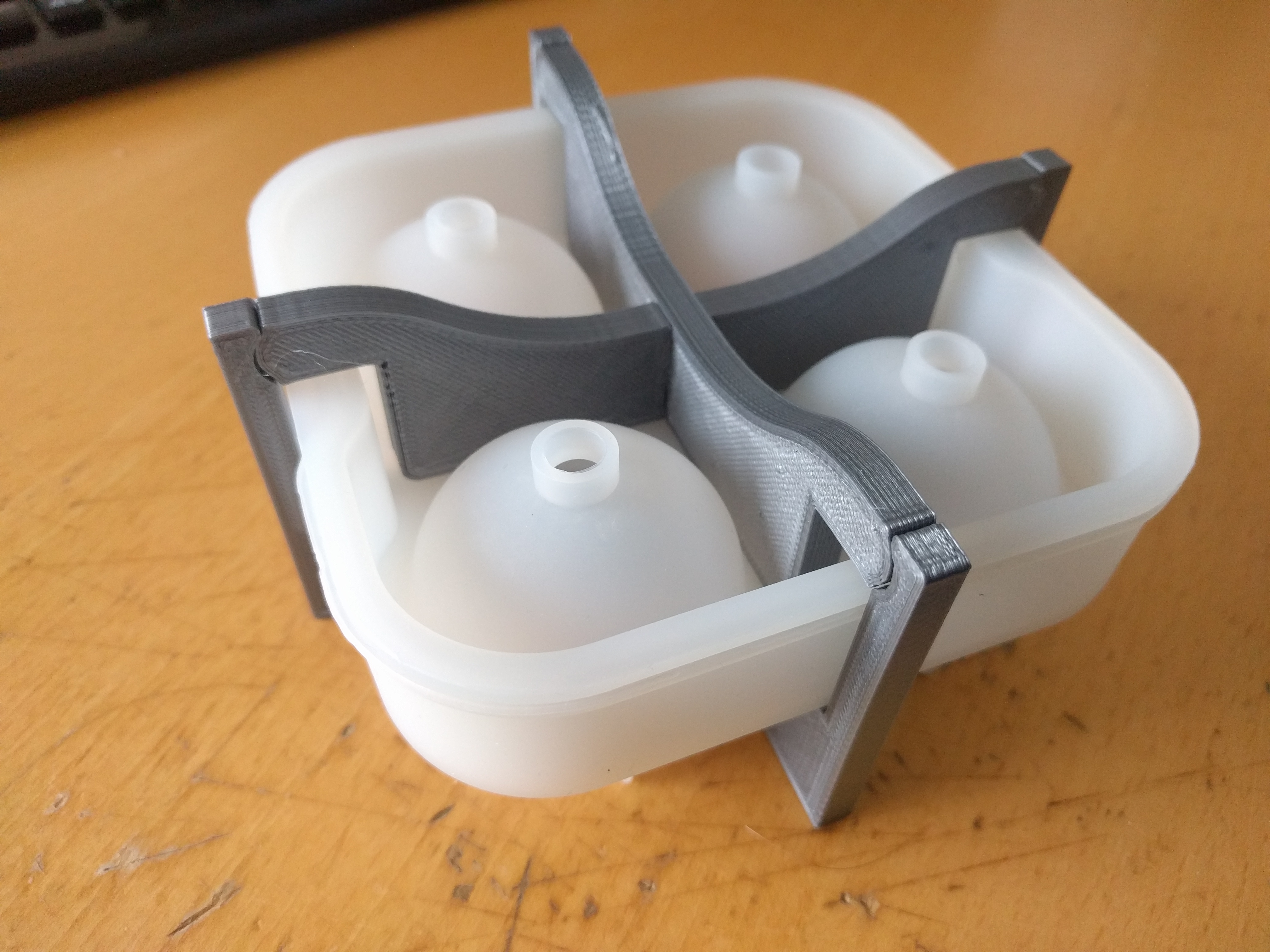 Ice ball holder (avoid floatup)