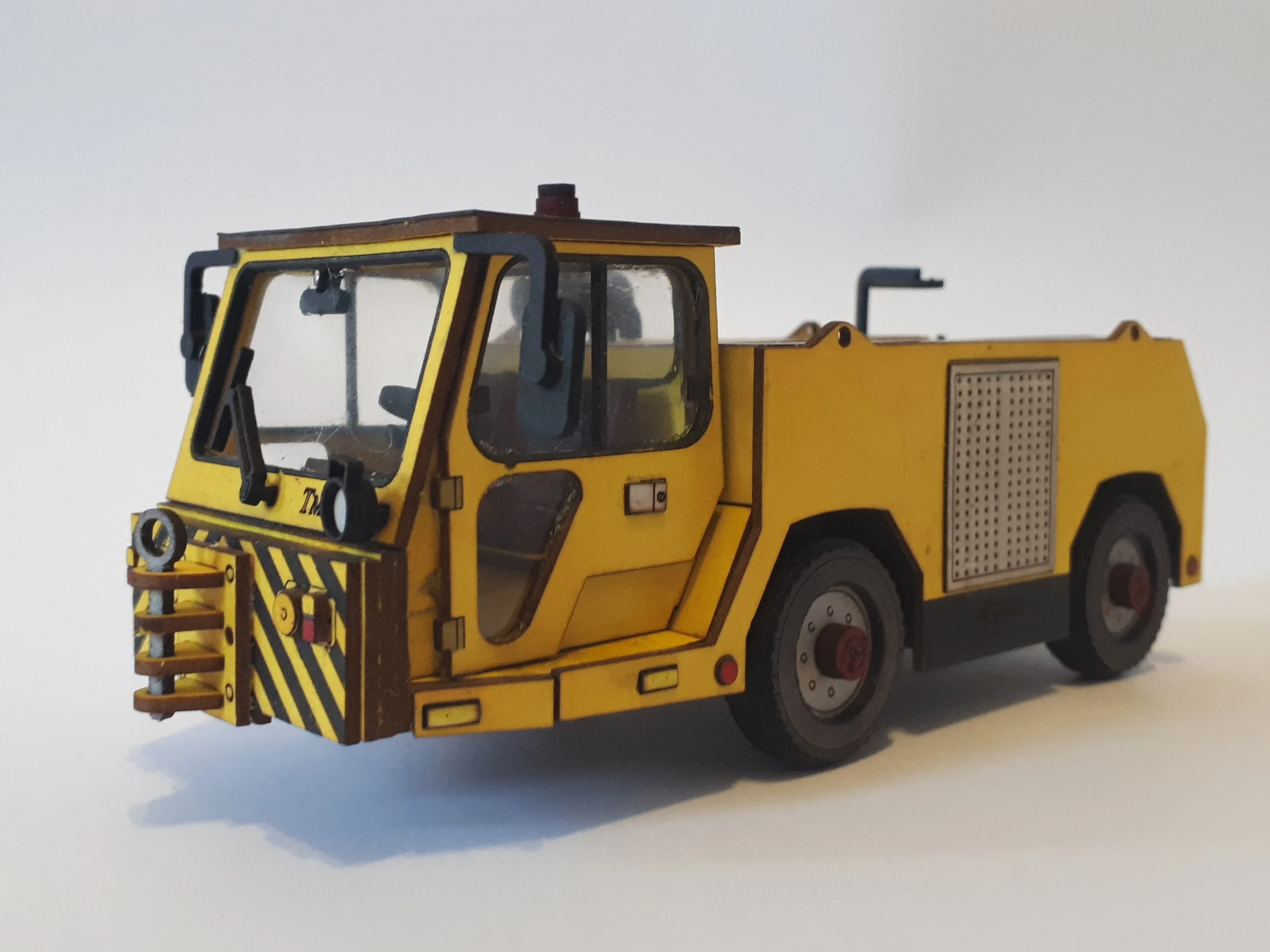 Airfield towing tractor TMX-60. Model 1:28 laser cutting. Cardboard.