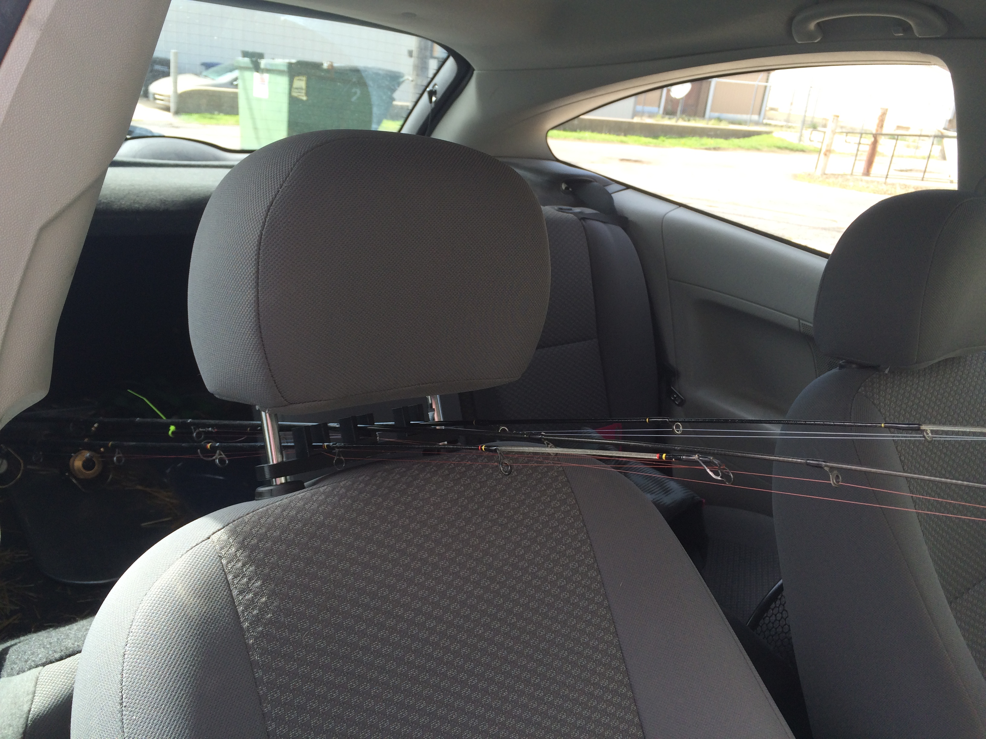 Head rest fishing pole holder
