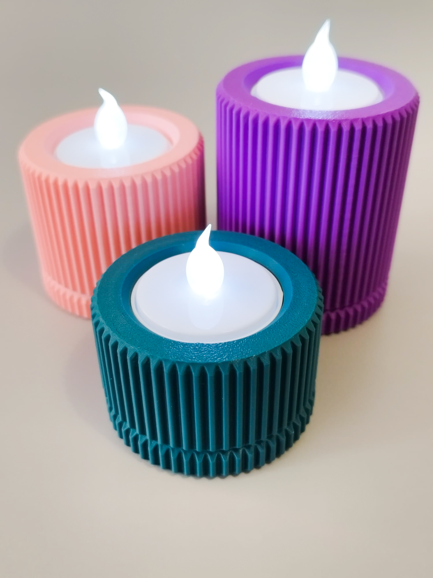 Candle holder with corduroy fabric texture.