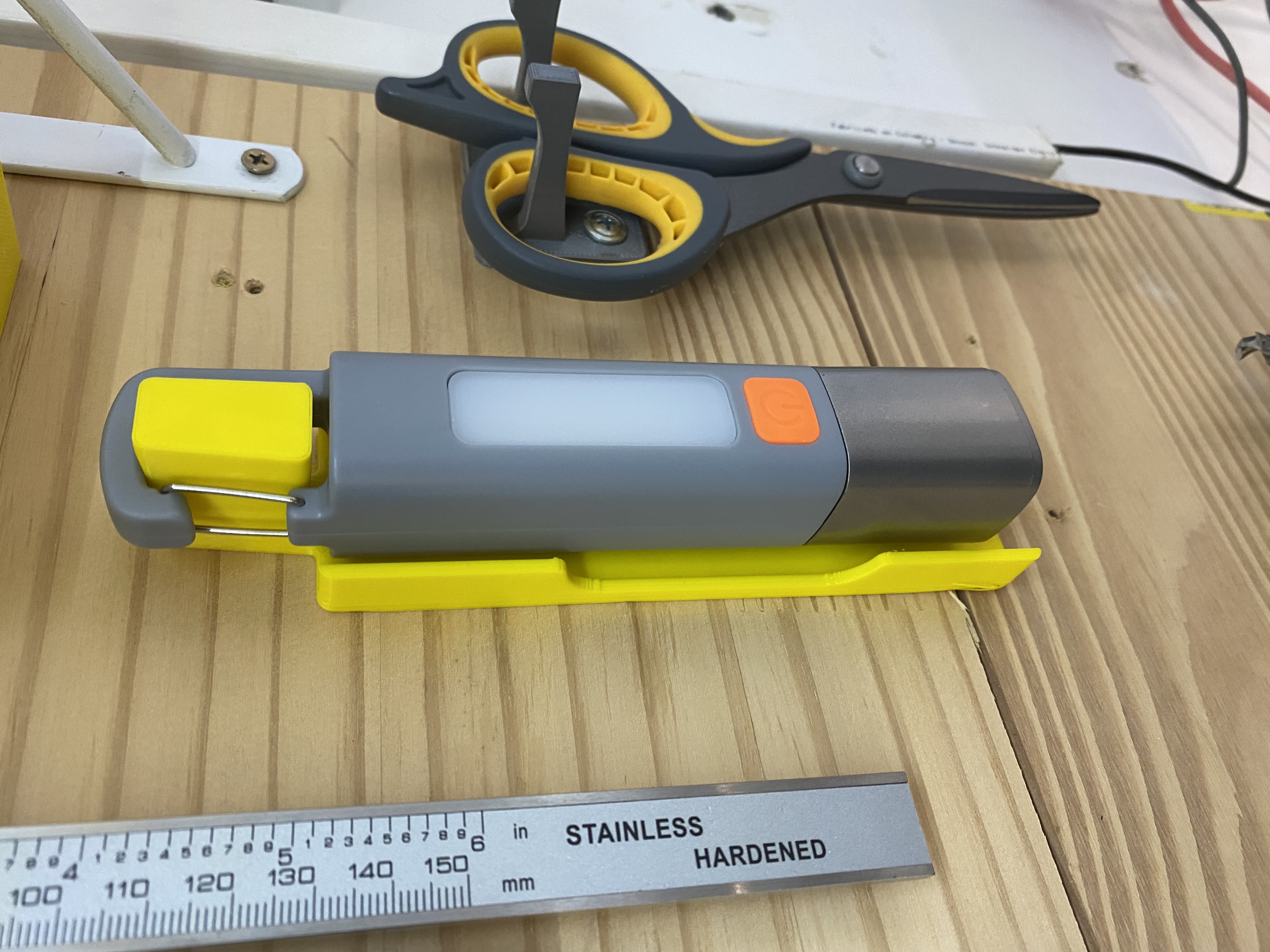 Flashlight wall holder