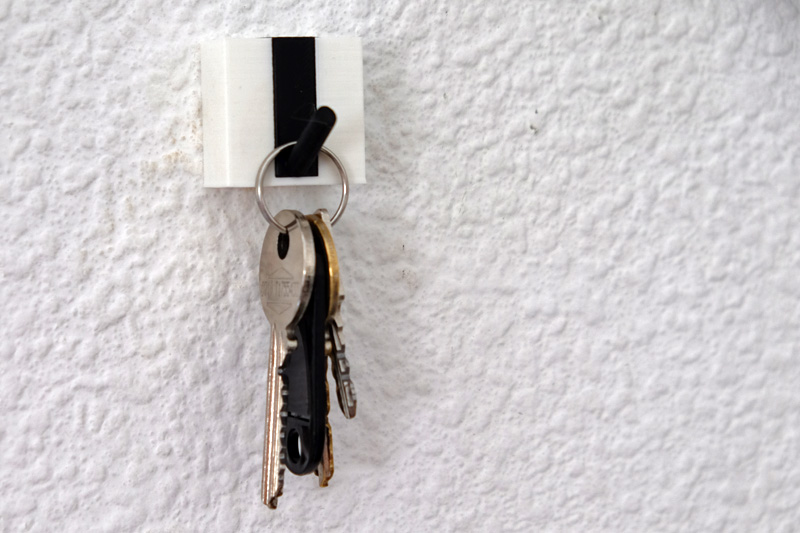 Key hook with hidden screw