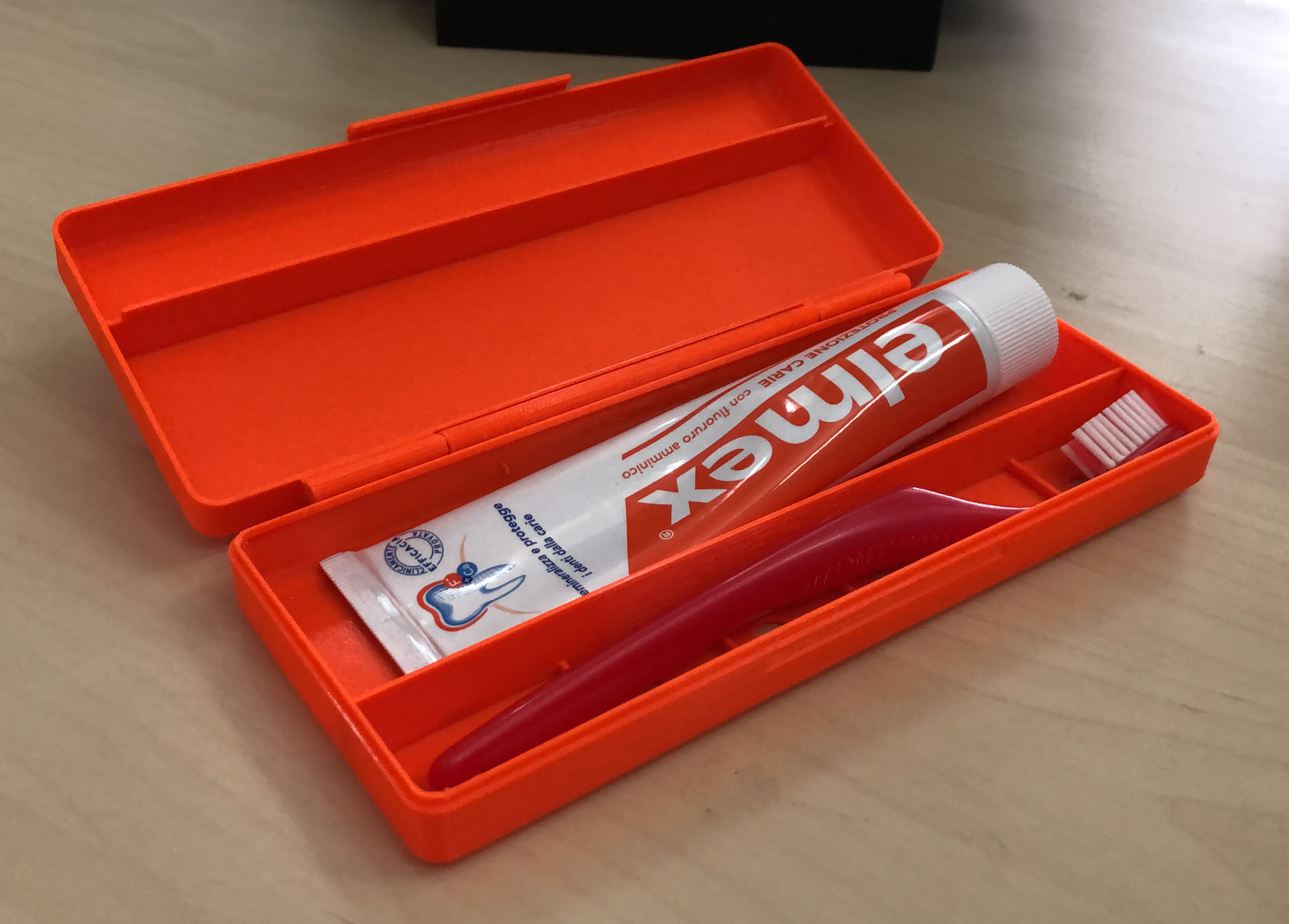 Tootbrush and toothpaste hinge in place holder [with fusion 360 source]