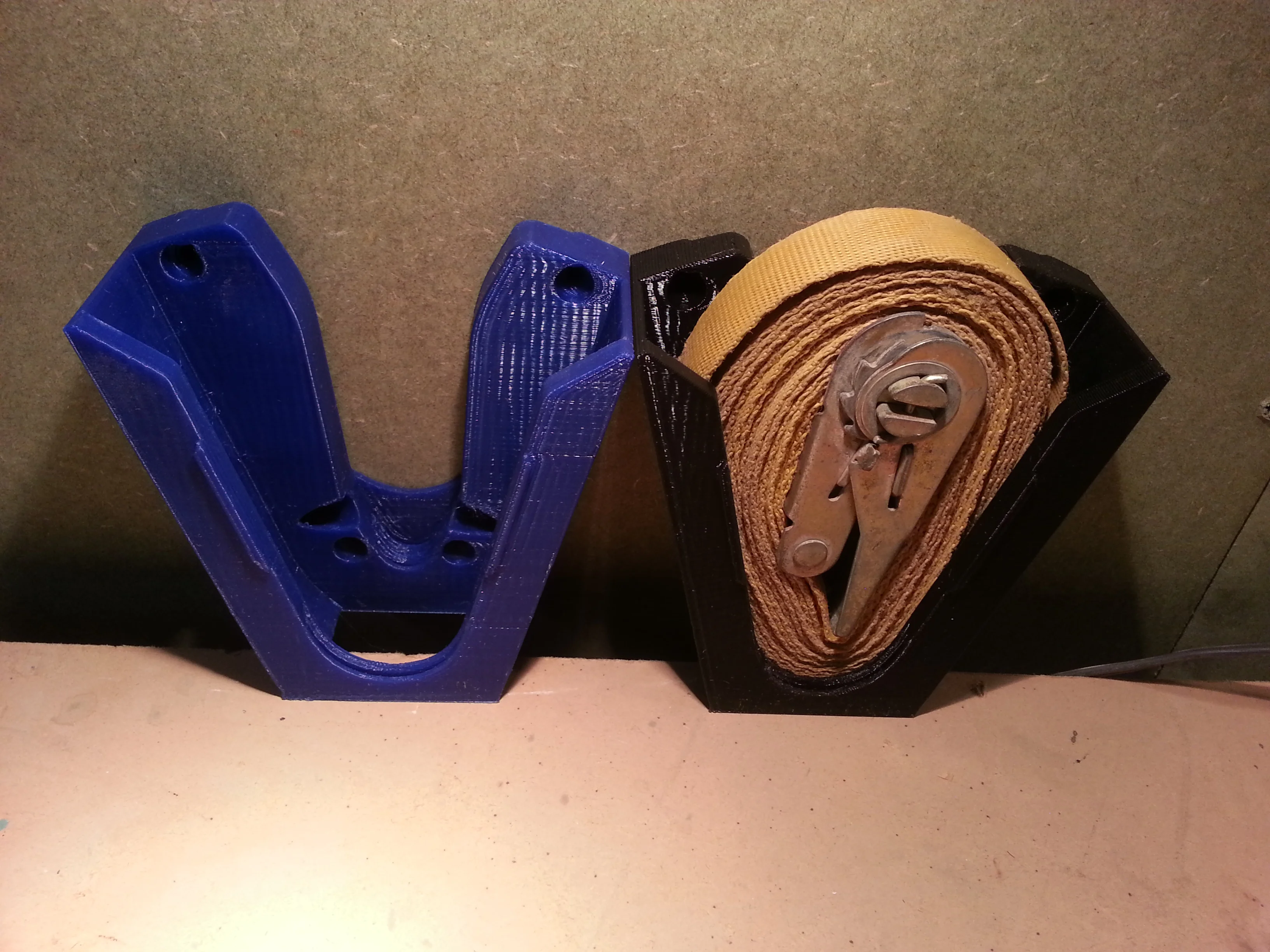 Strap holder / tie down belt holder