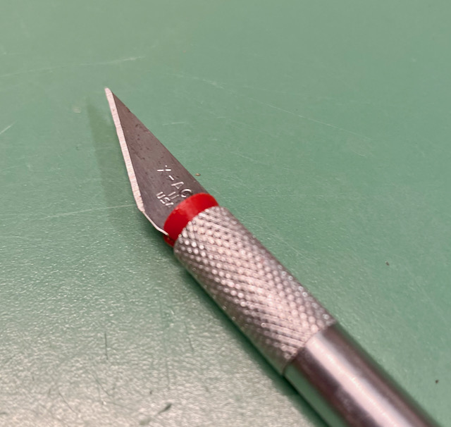 Xacto knife insert