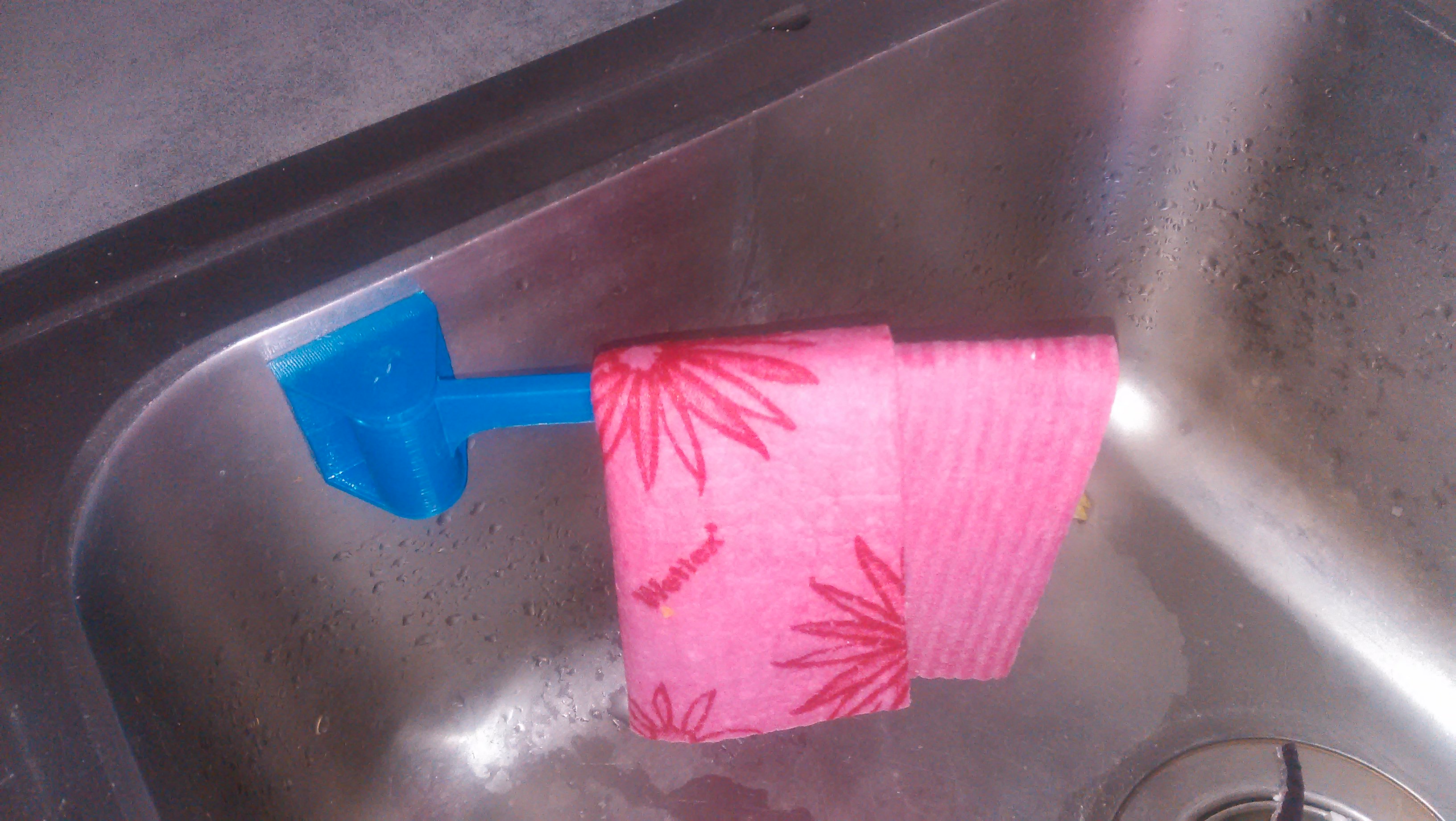 Dishcloth hanger with magnet slot