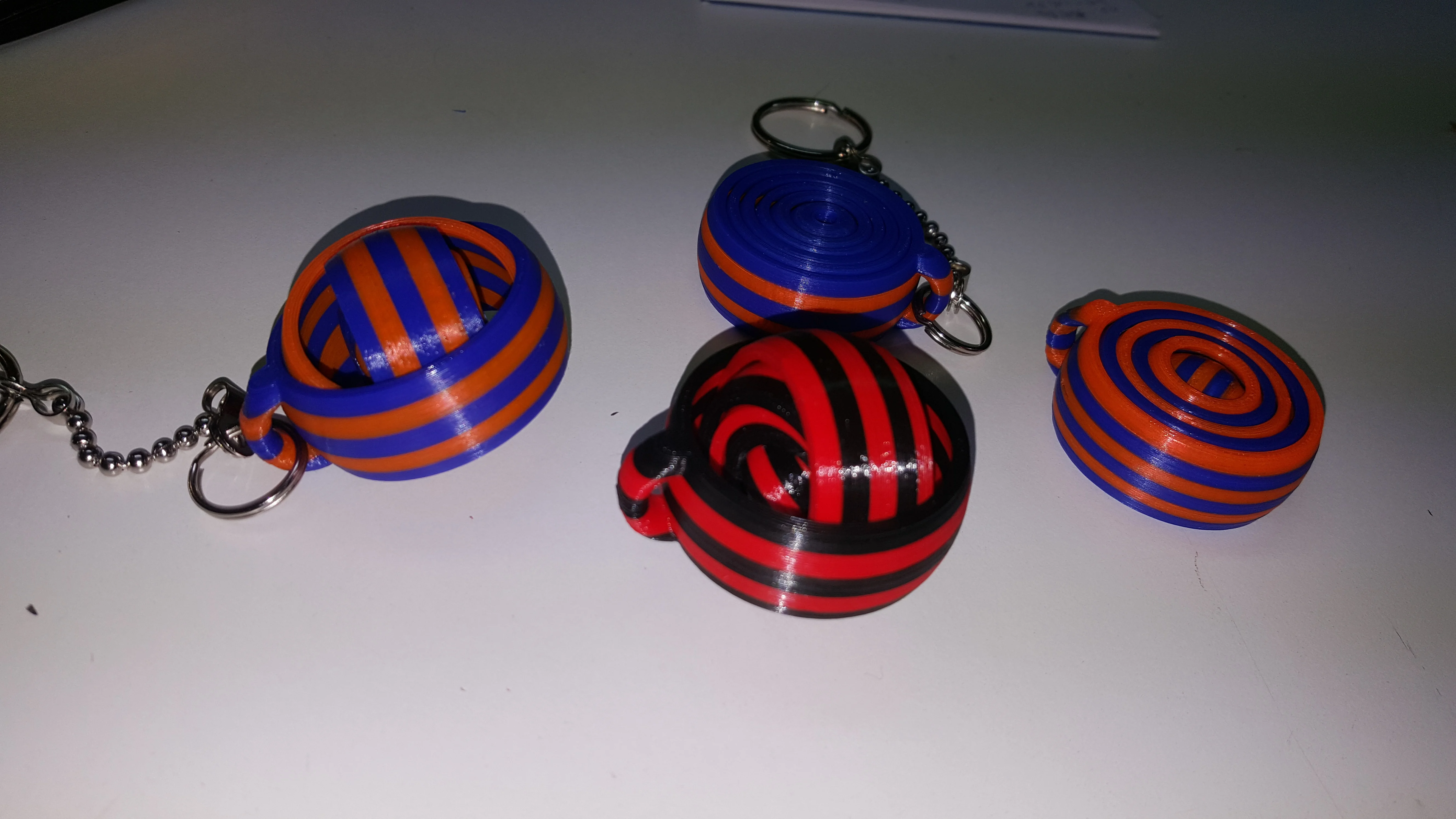 Gyroscopic relaxing keyring dual color, two color, four color, or more