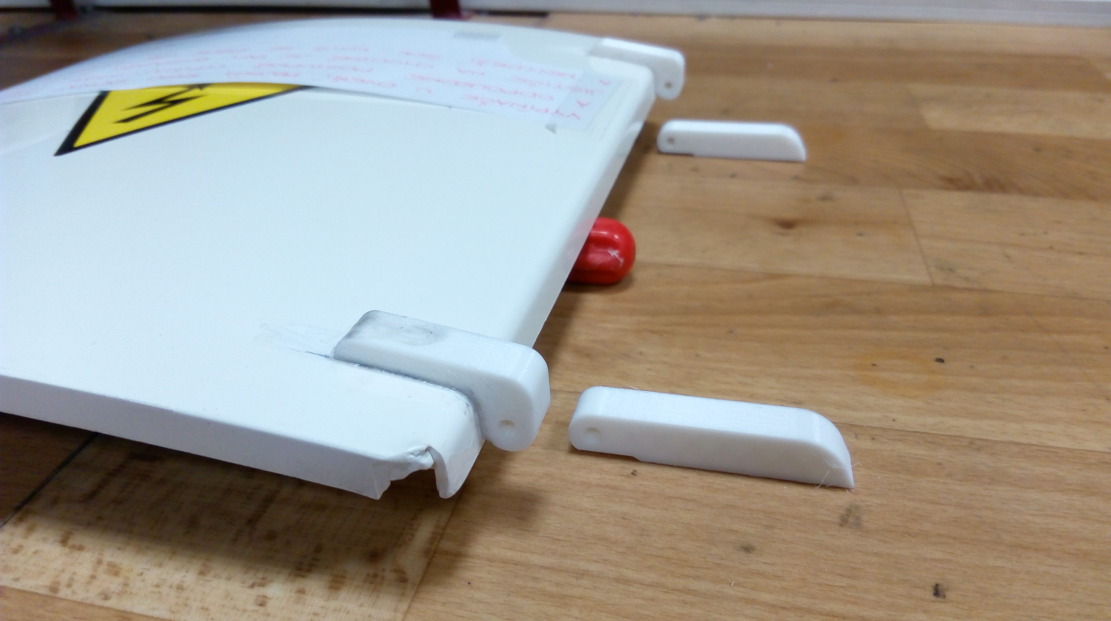 Pant/hinge for repair of switchboard cabinet.