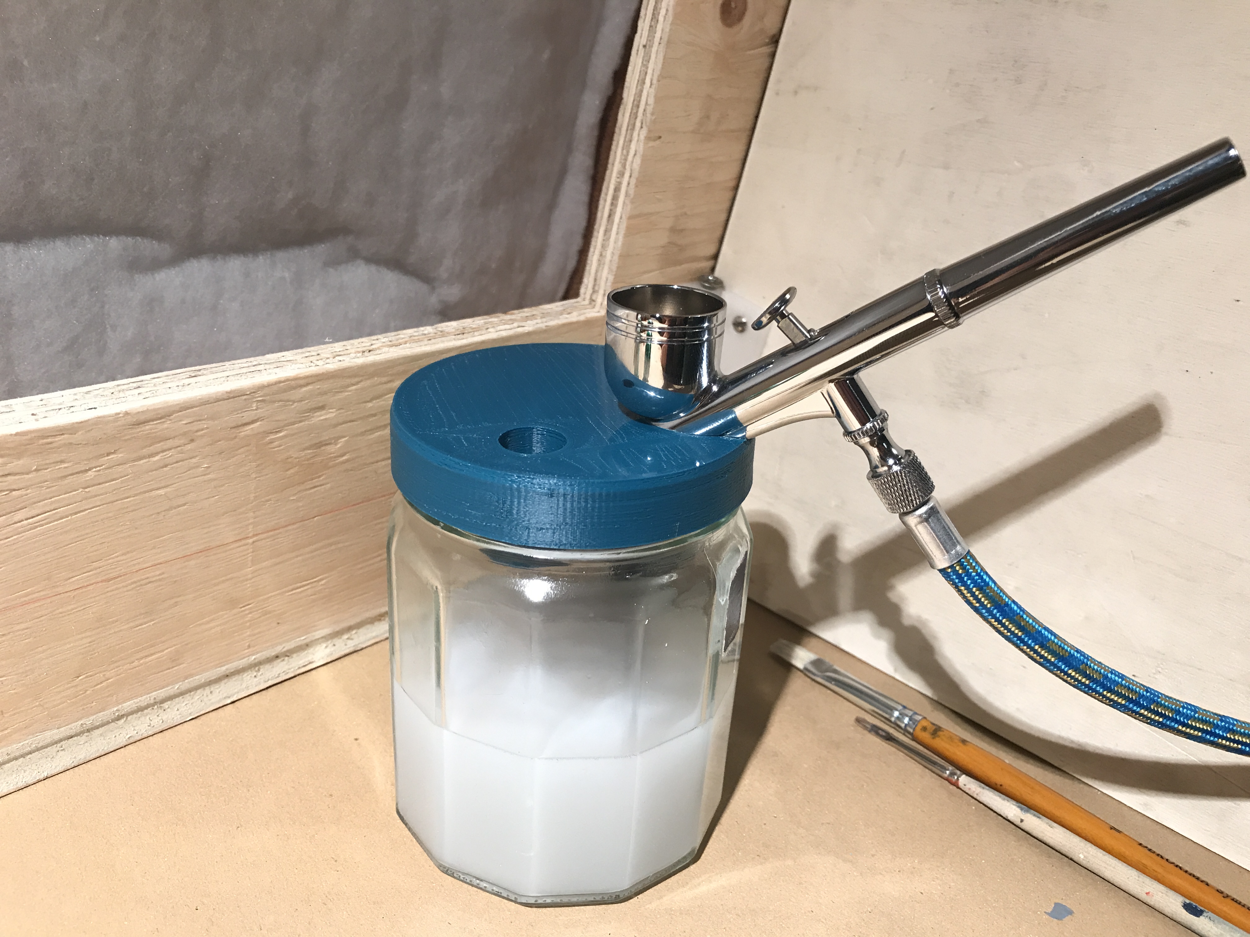 Glass jar airbrush stand.