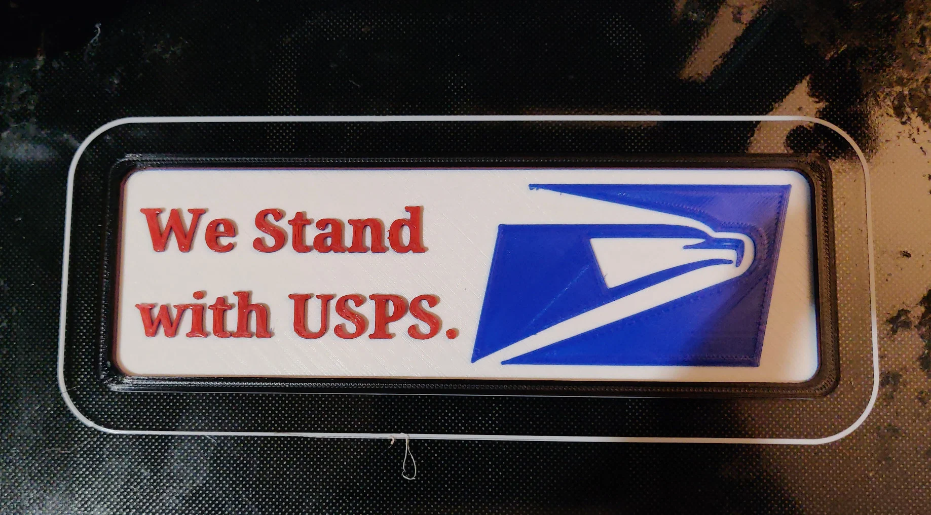 We stand with the USPS sign