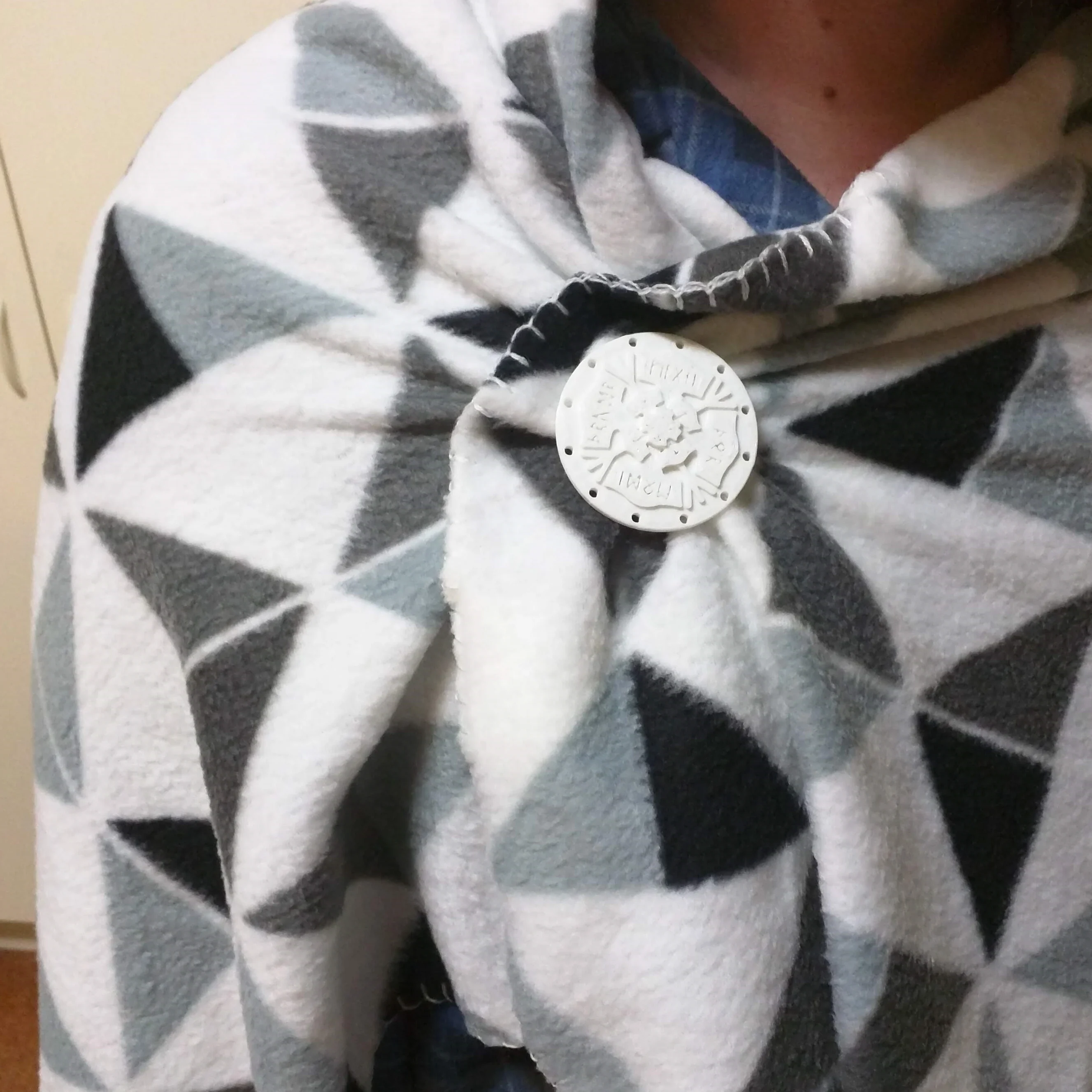 Thor symbol cloak fastener