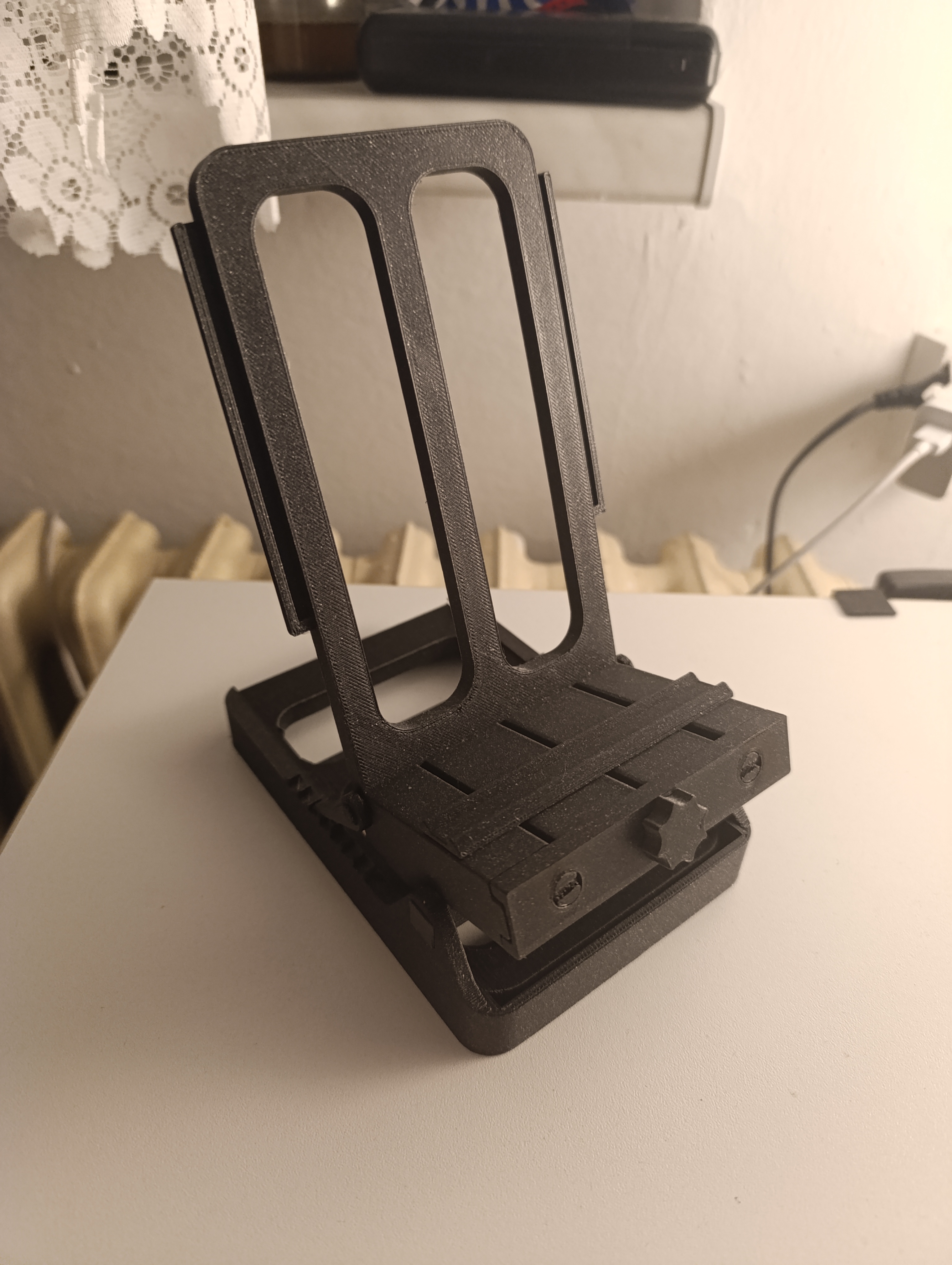 Multifunctional adjustable stand for mobile phone, book, tablet with side extensions