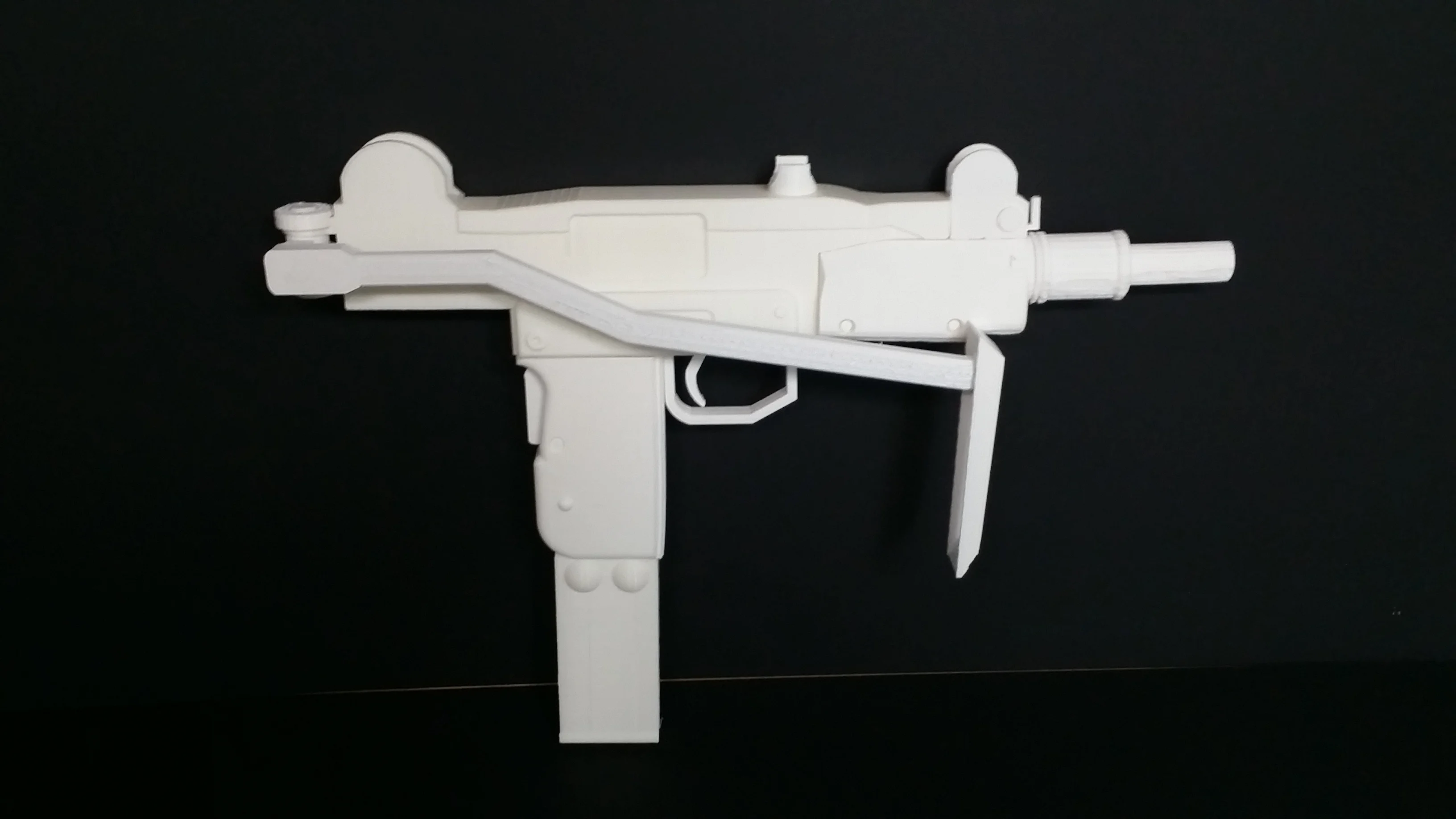 Mini-Uzi submachine gun with shoulder stock opened. (Replica)