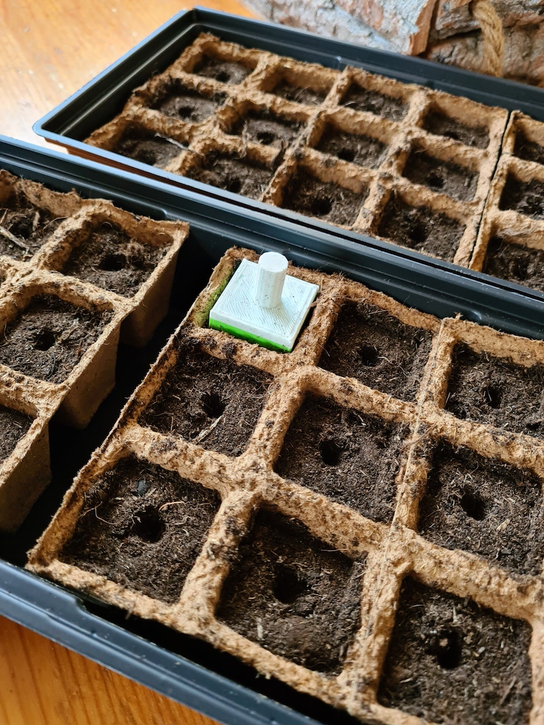 Growing seed tray stamper