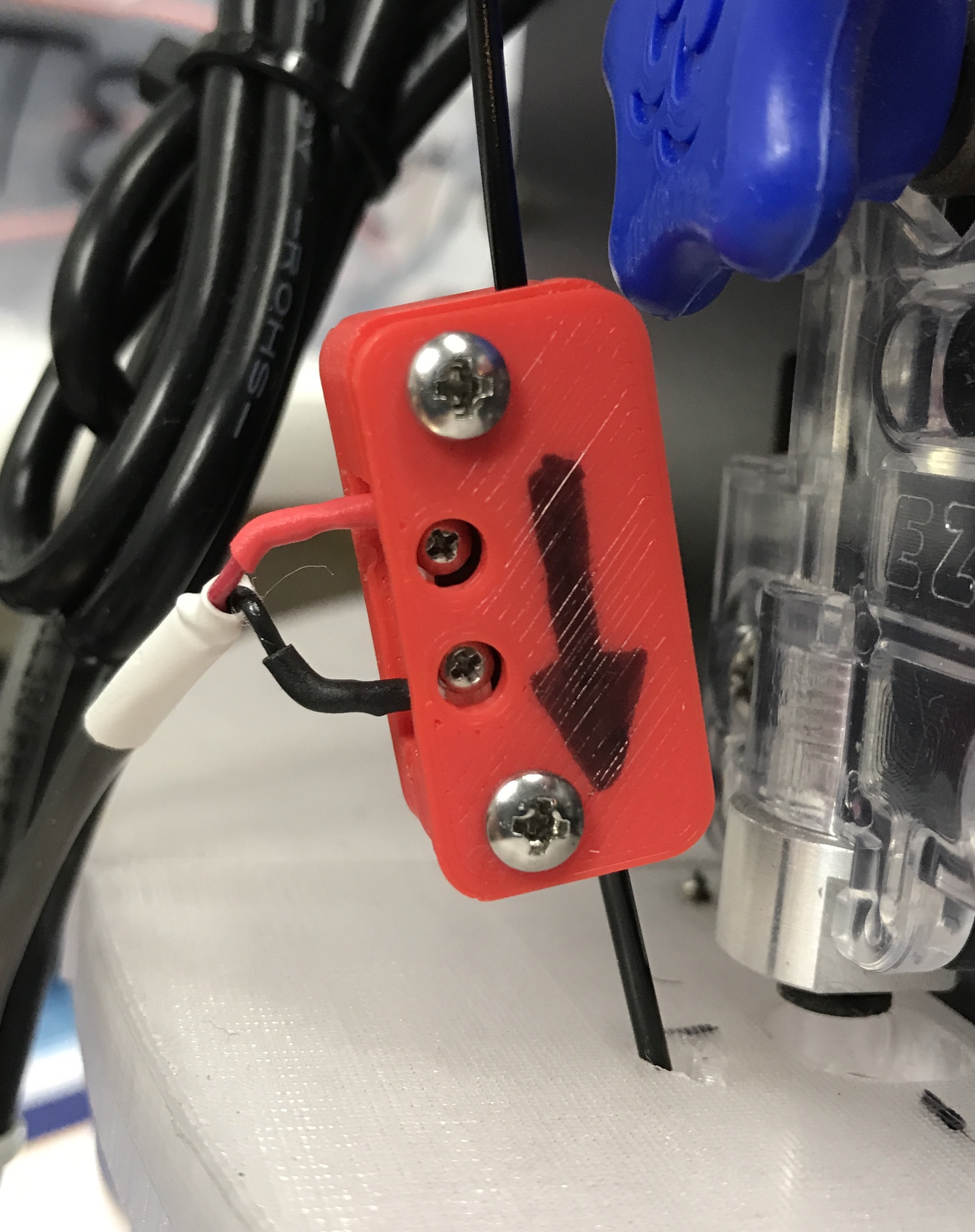 Filament sensor microswitch housing