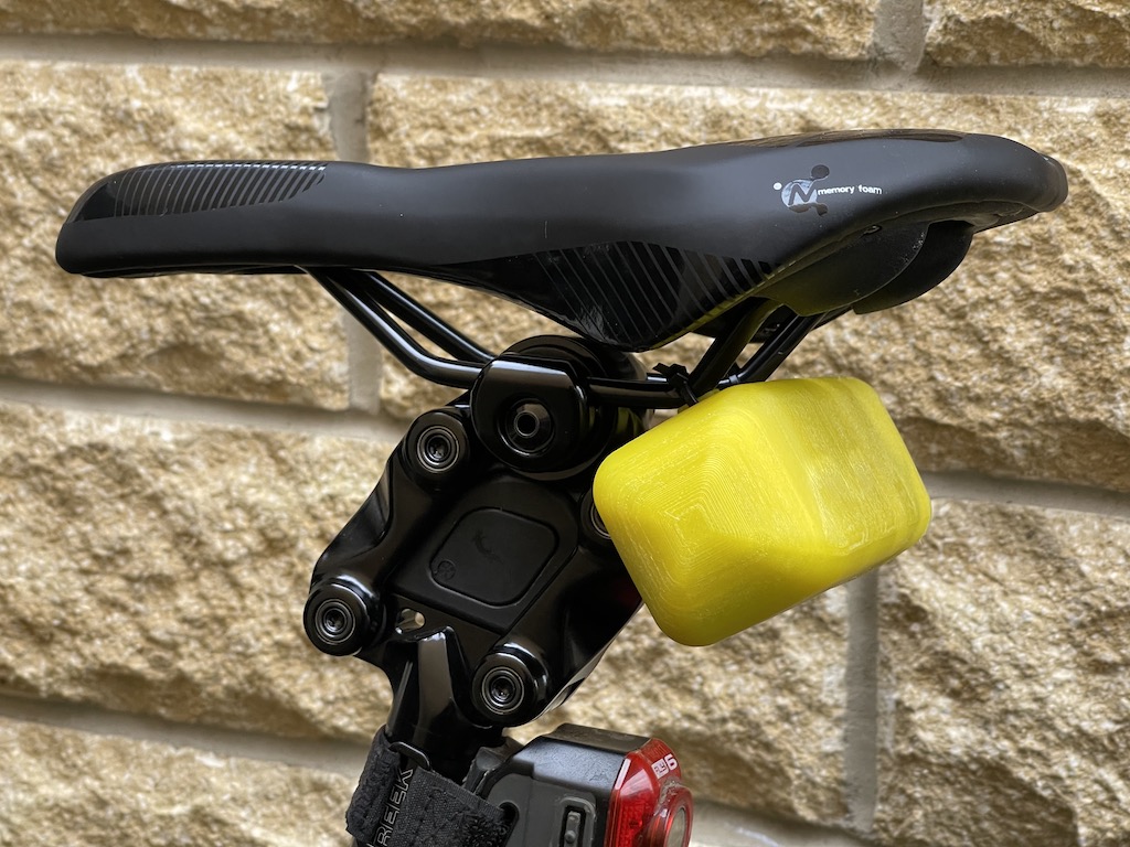Cycle saddle-mounted inner tube carrier