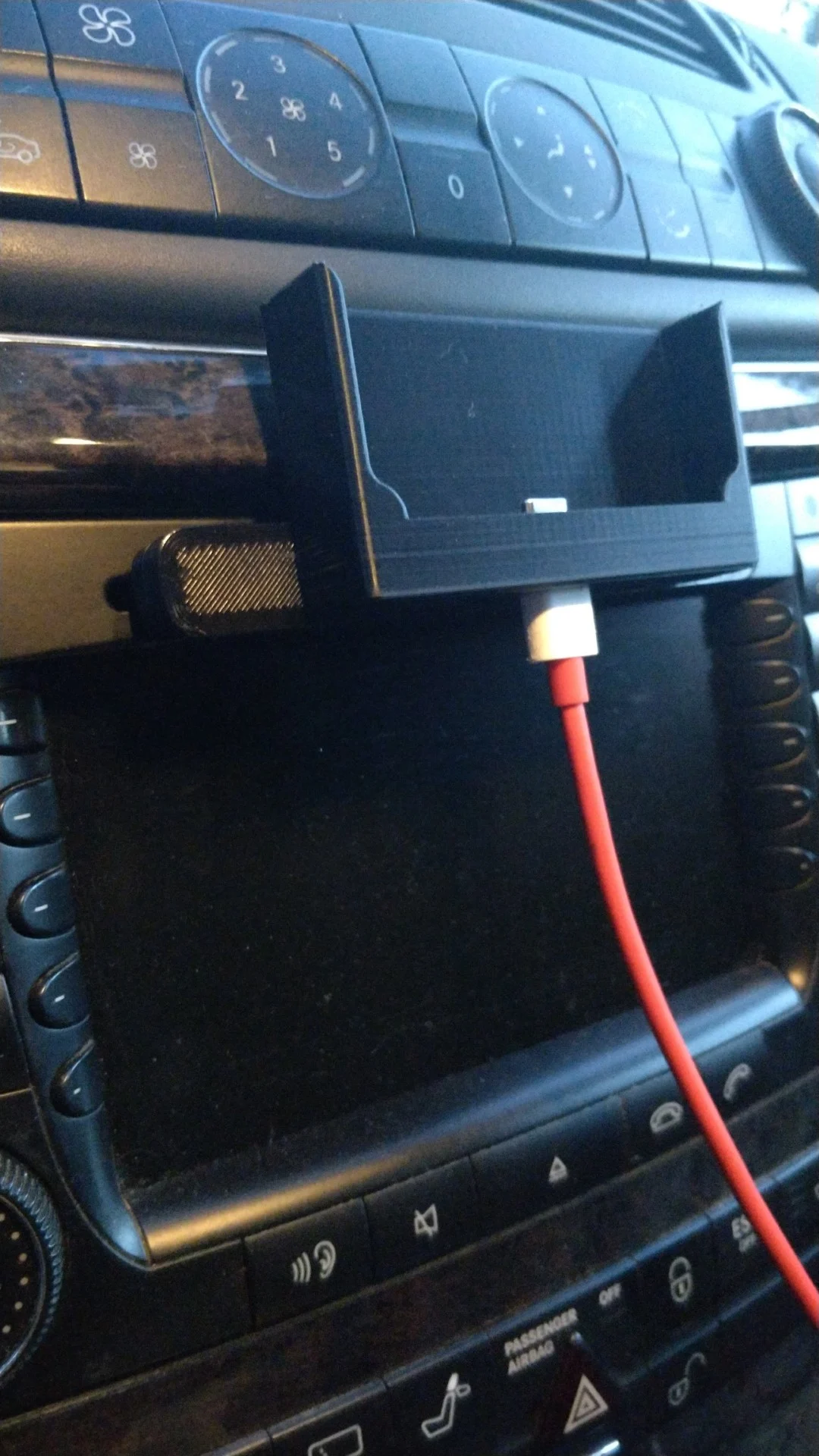 Phone holder for CD slot