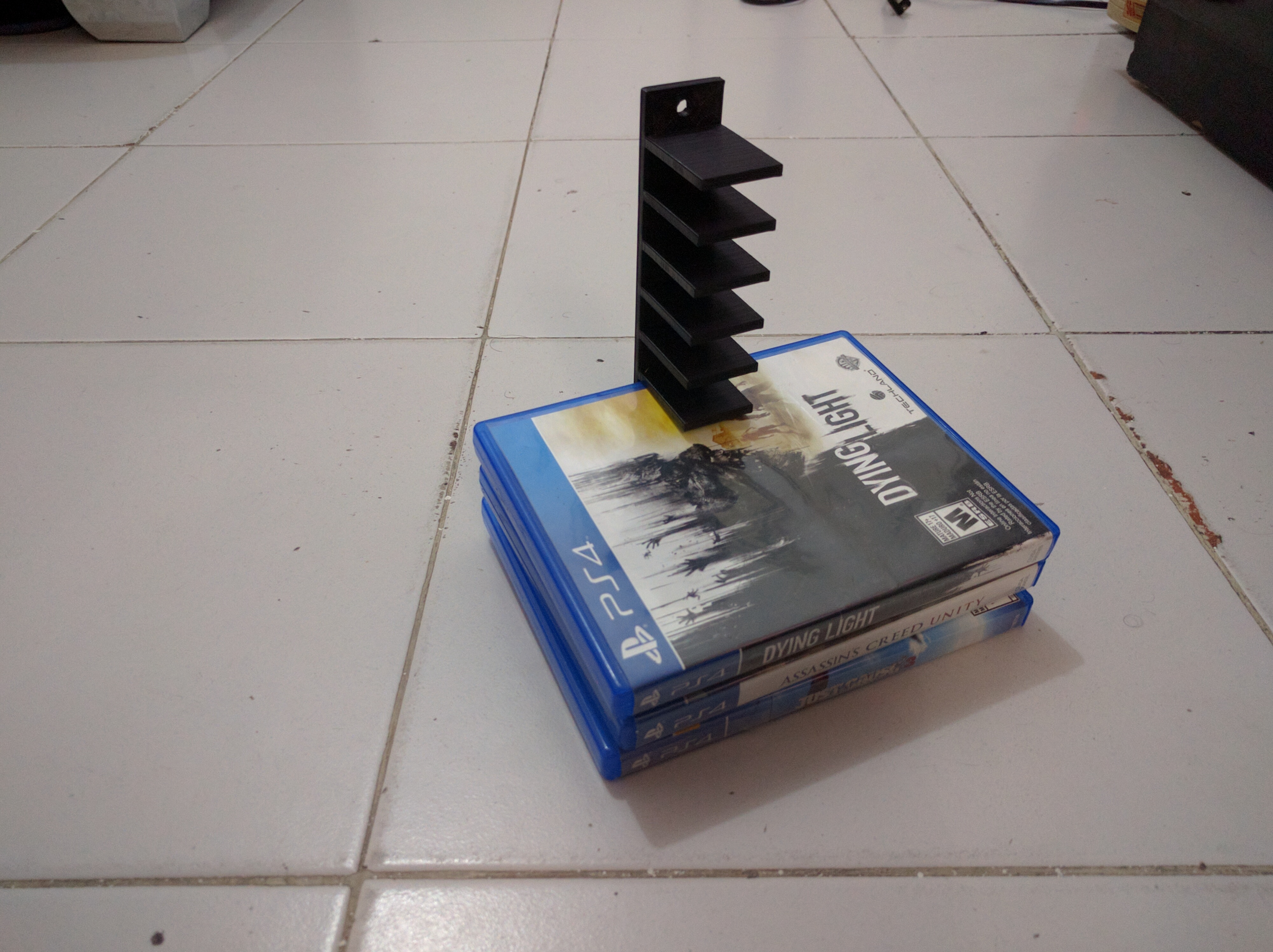 PS4 - Blu Ray wall rack/hanger