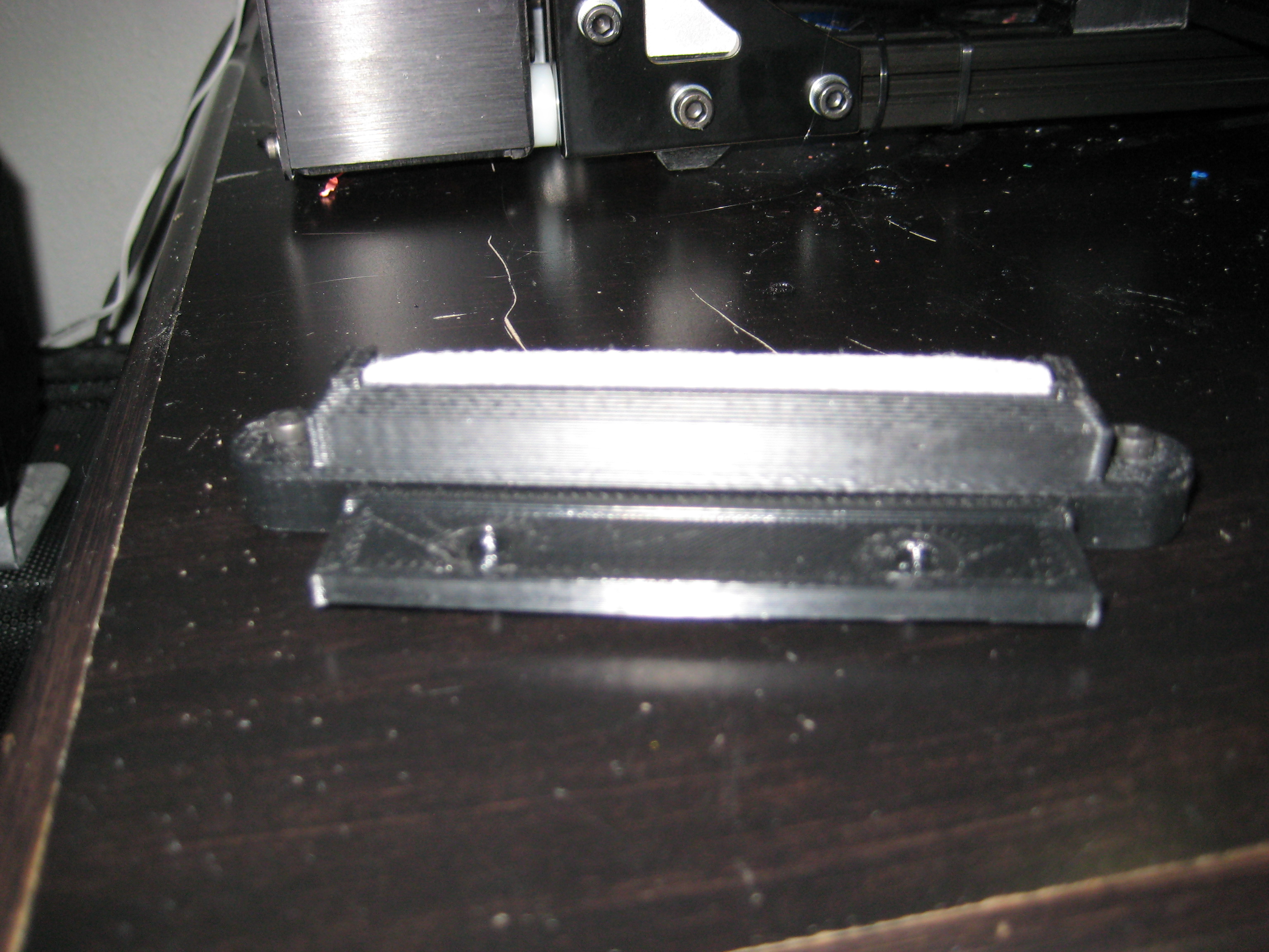 Retrofit Nozzle wiper for mounting a Lulzbot Mini style bed wiper to a Taz or other printer