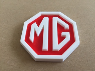 MG Logo with printed (colored) inset