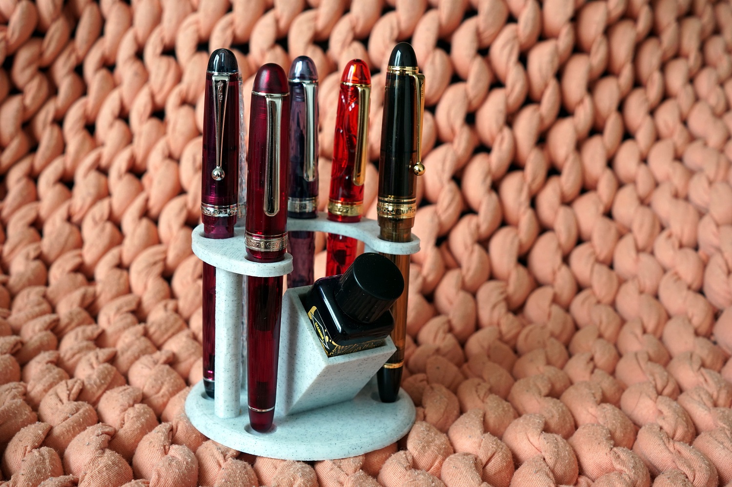 Fountain pen and ink bottle stand and desk organiser