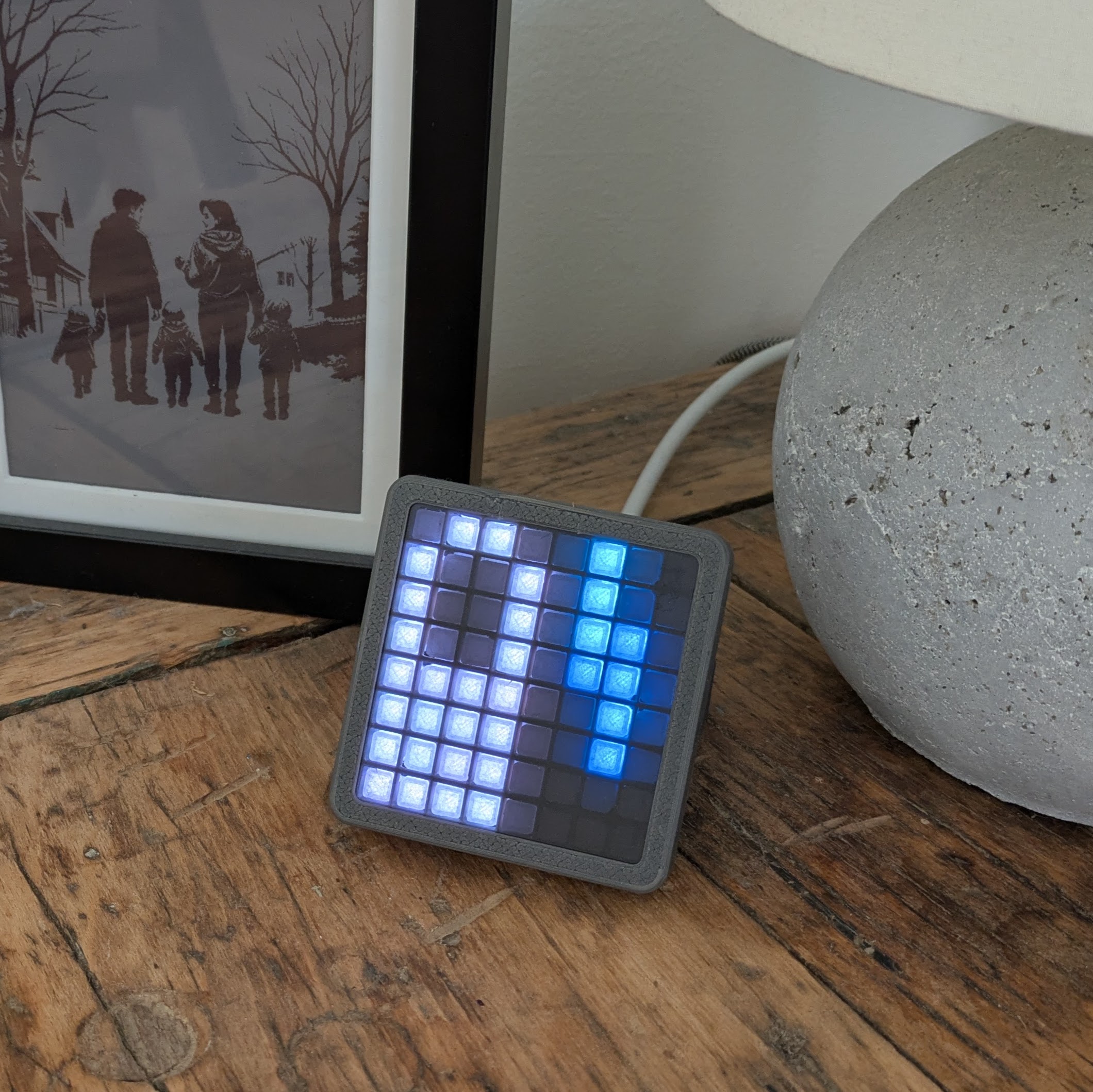 LED matrix desktop stand with ESP32 integration for smart home applications.