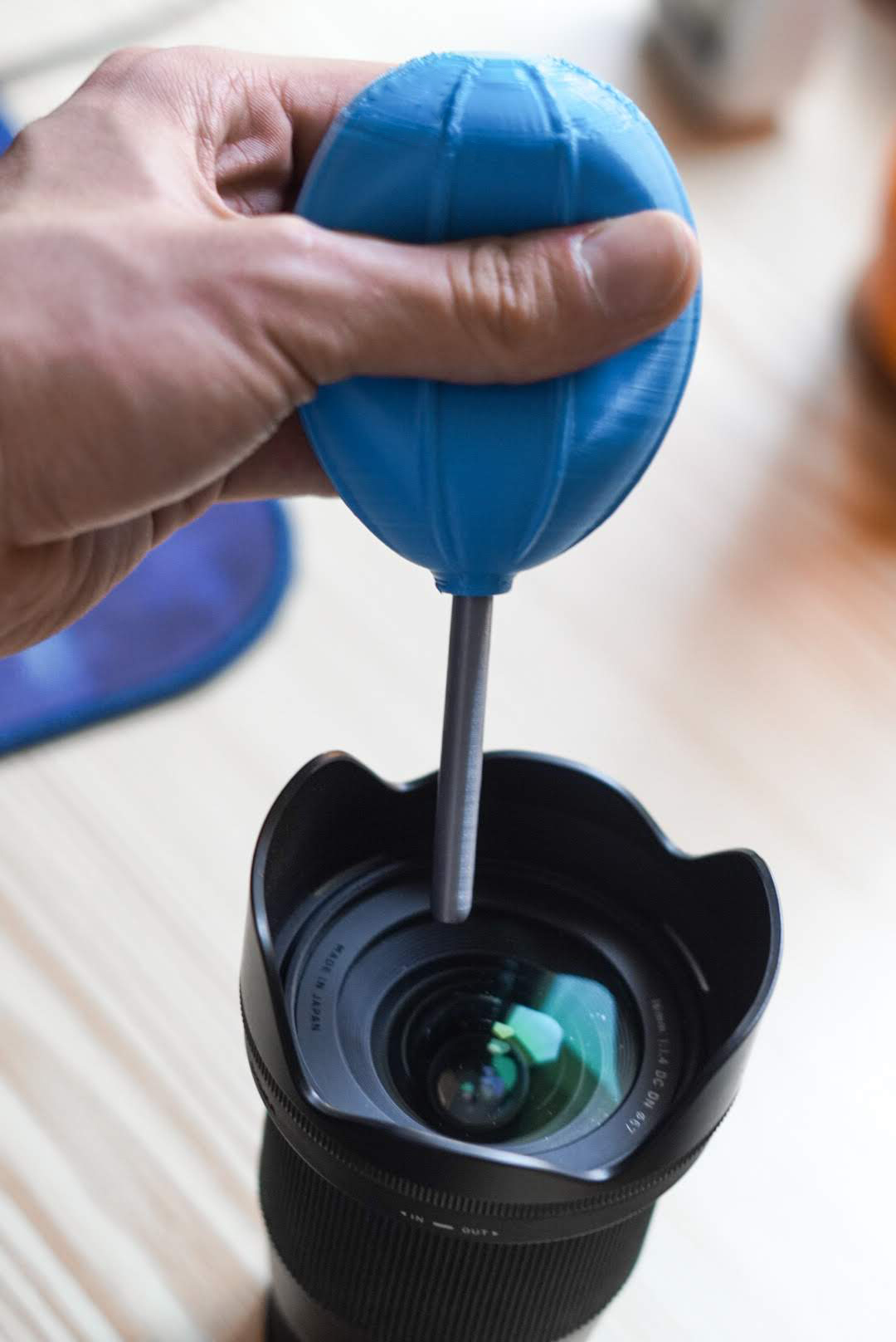 Lens air blower