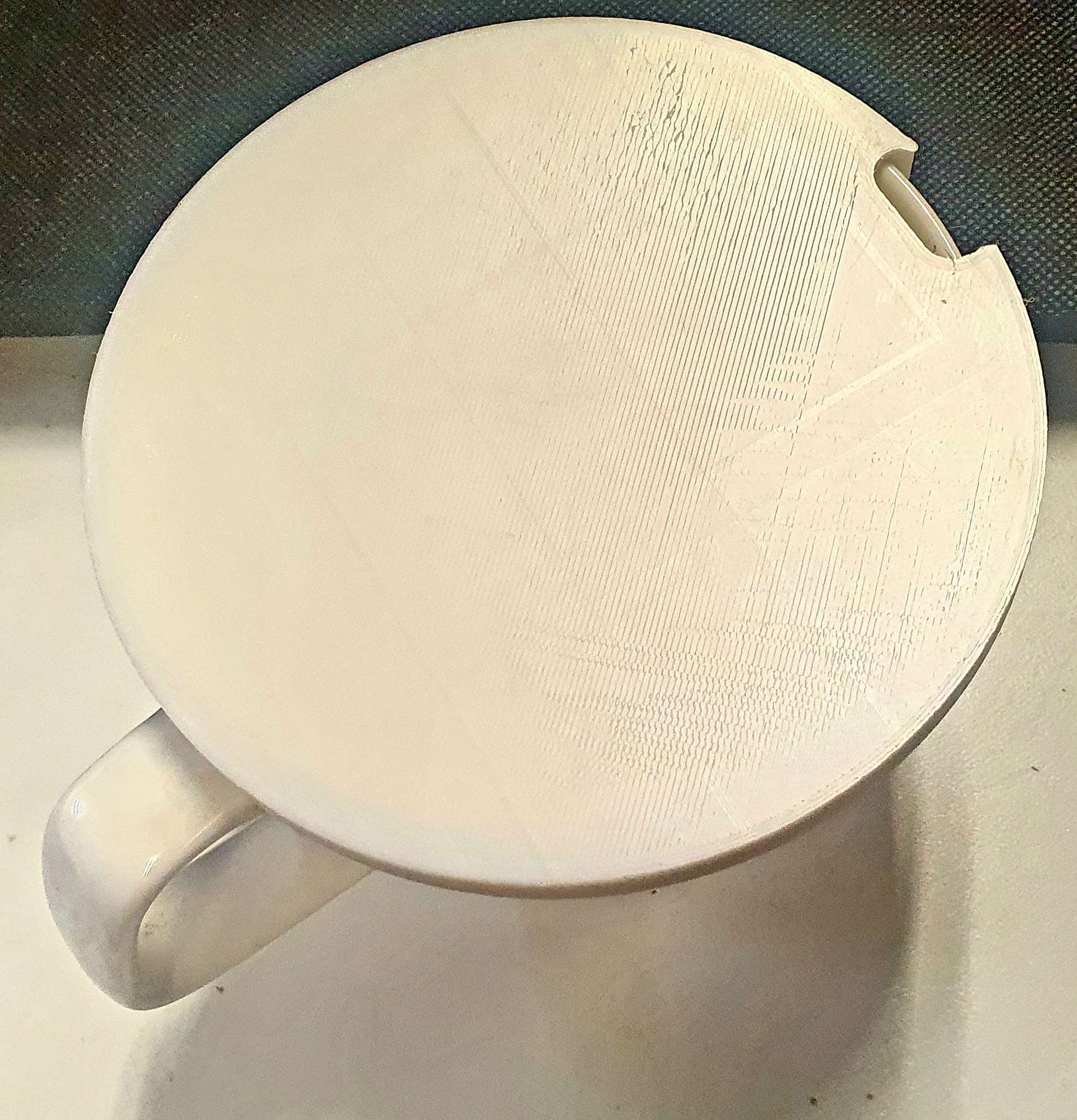 Mug cover with spoon slot