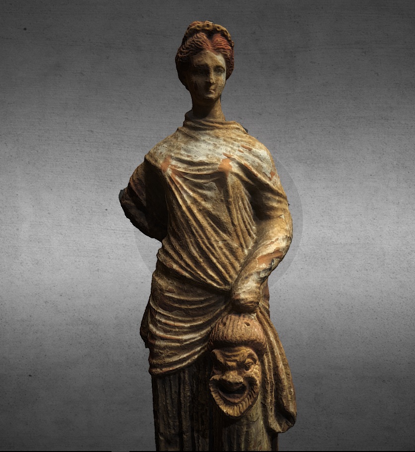 Woman holding a comedy mask