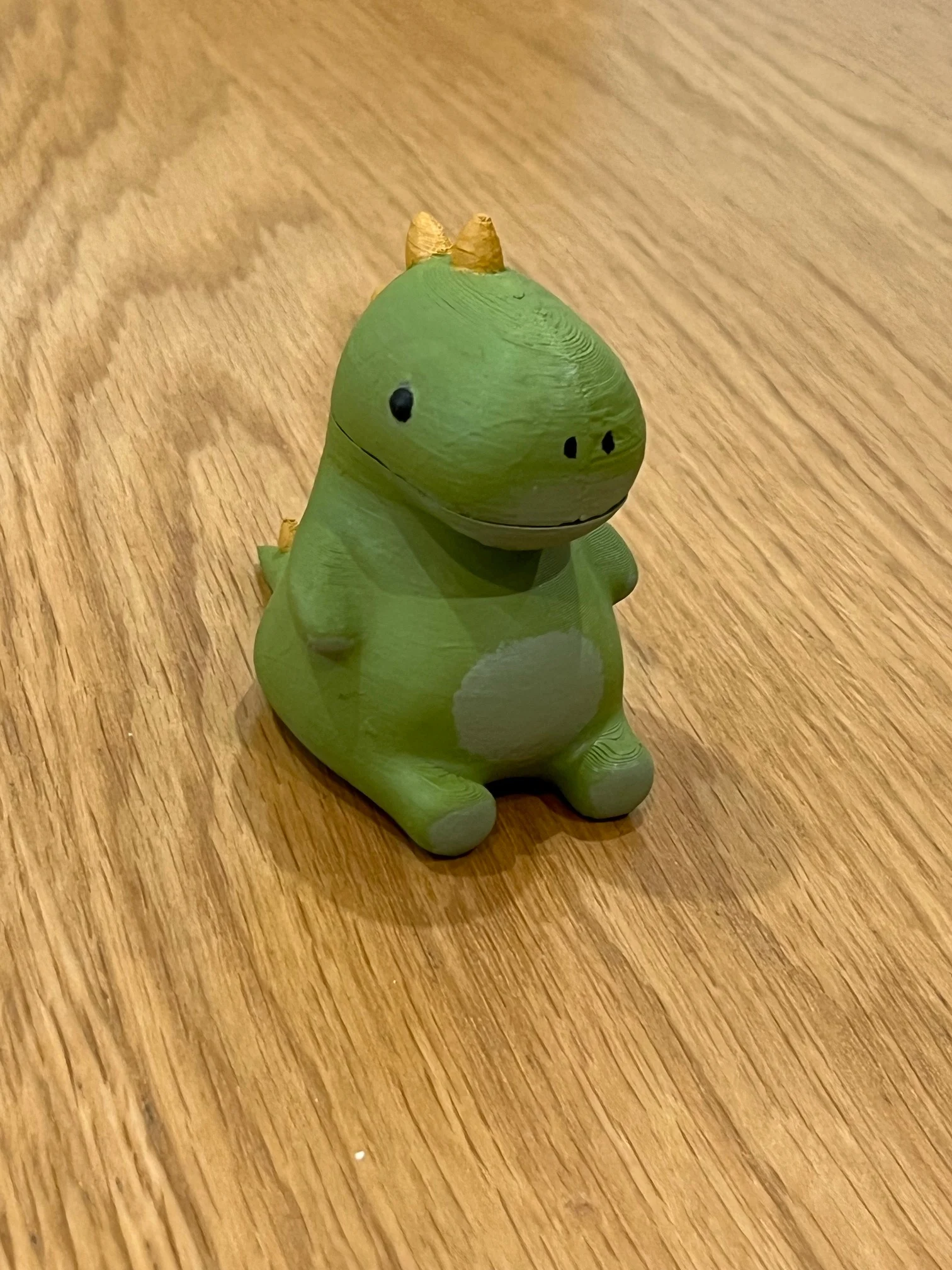 Chubby dinosaur with hidden compartment