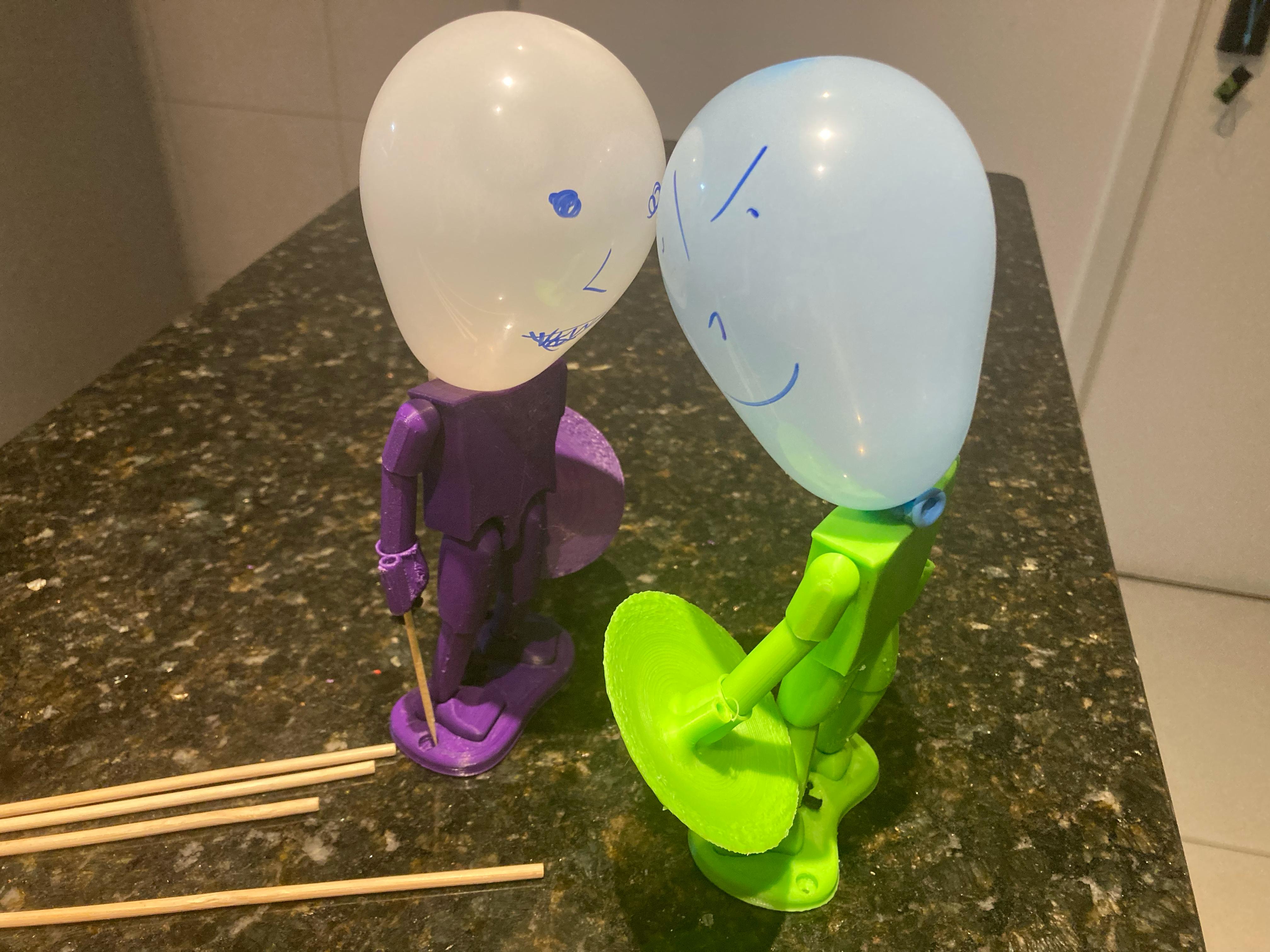 Balloon head puppet fencing fighter